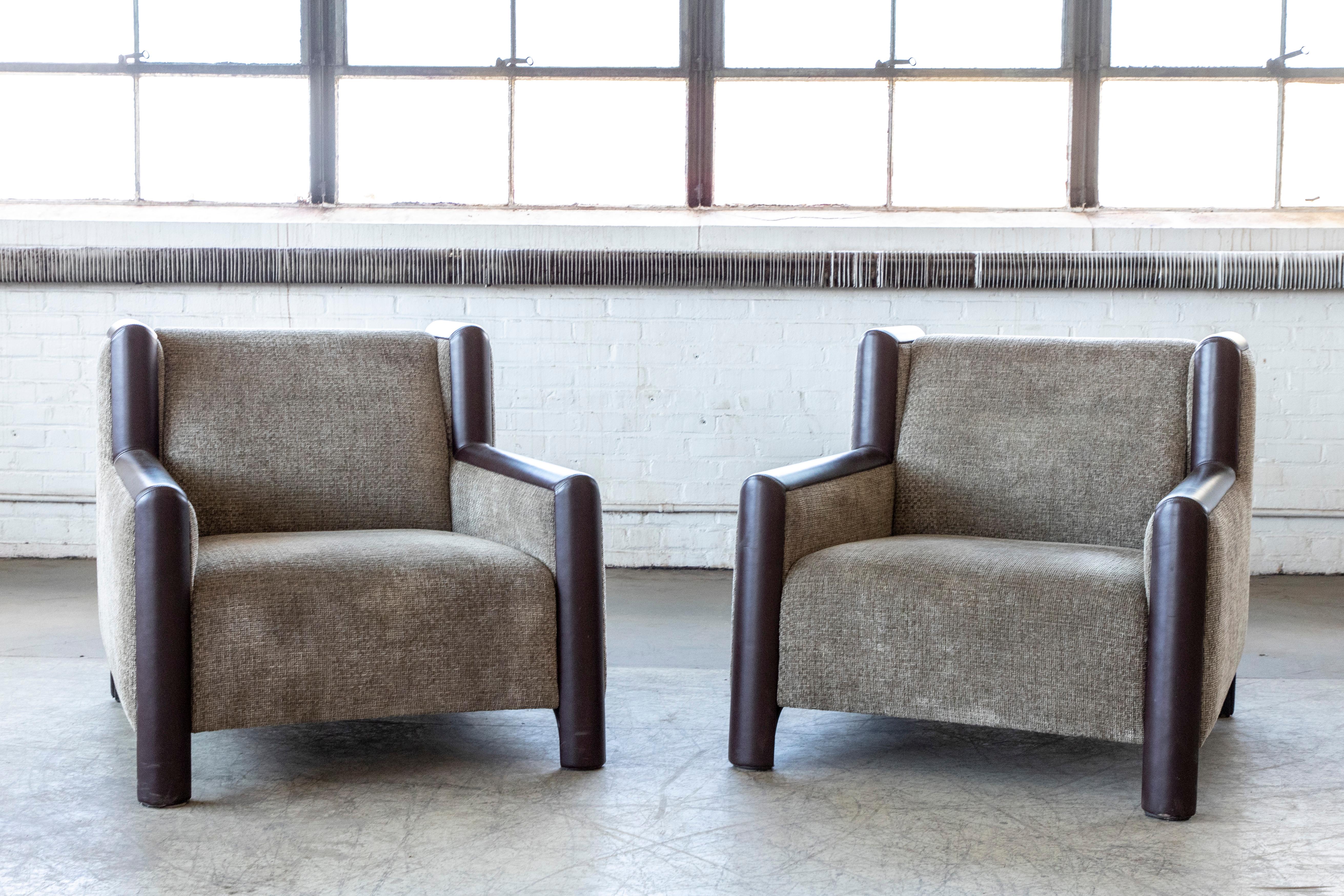 A pair of vintage contemporary 'Ginevra' lounge chairs by Romeo Sozzi for Promemoria Furniture. Very plush and very comfortable. Solid and sturdy handmade in Italy and upholstered in a tweed-like wool and with chocolate colored leather on the edges.