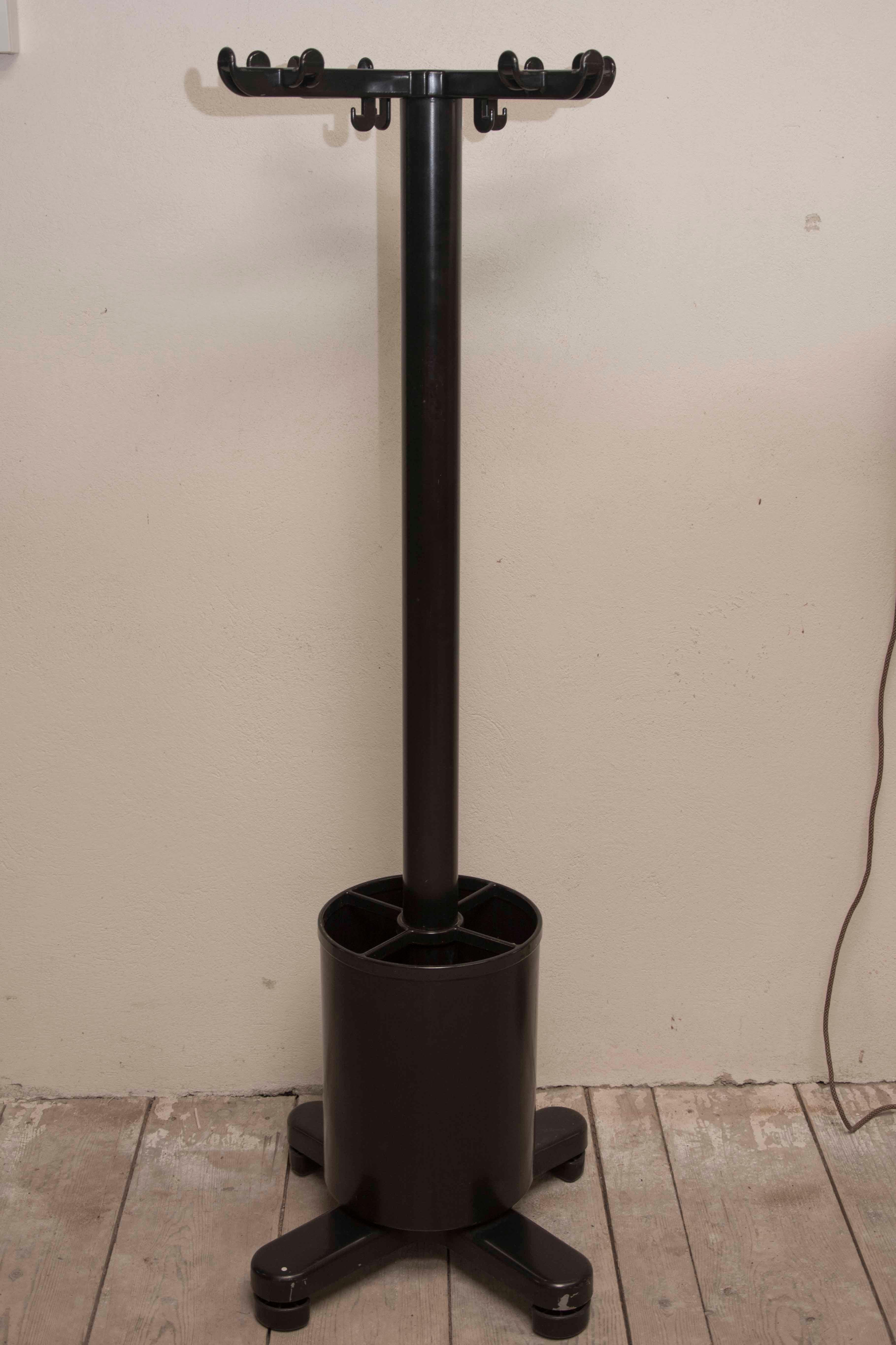 These freestanding coat rack were designed in 1973 by Ettore Sottsass for Olivetti and produced in Italy. It features an umbrella Stand resting on the base. It was constructed of steel, aluminium and plastic. Wear consistent with age and use. It´s a