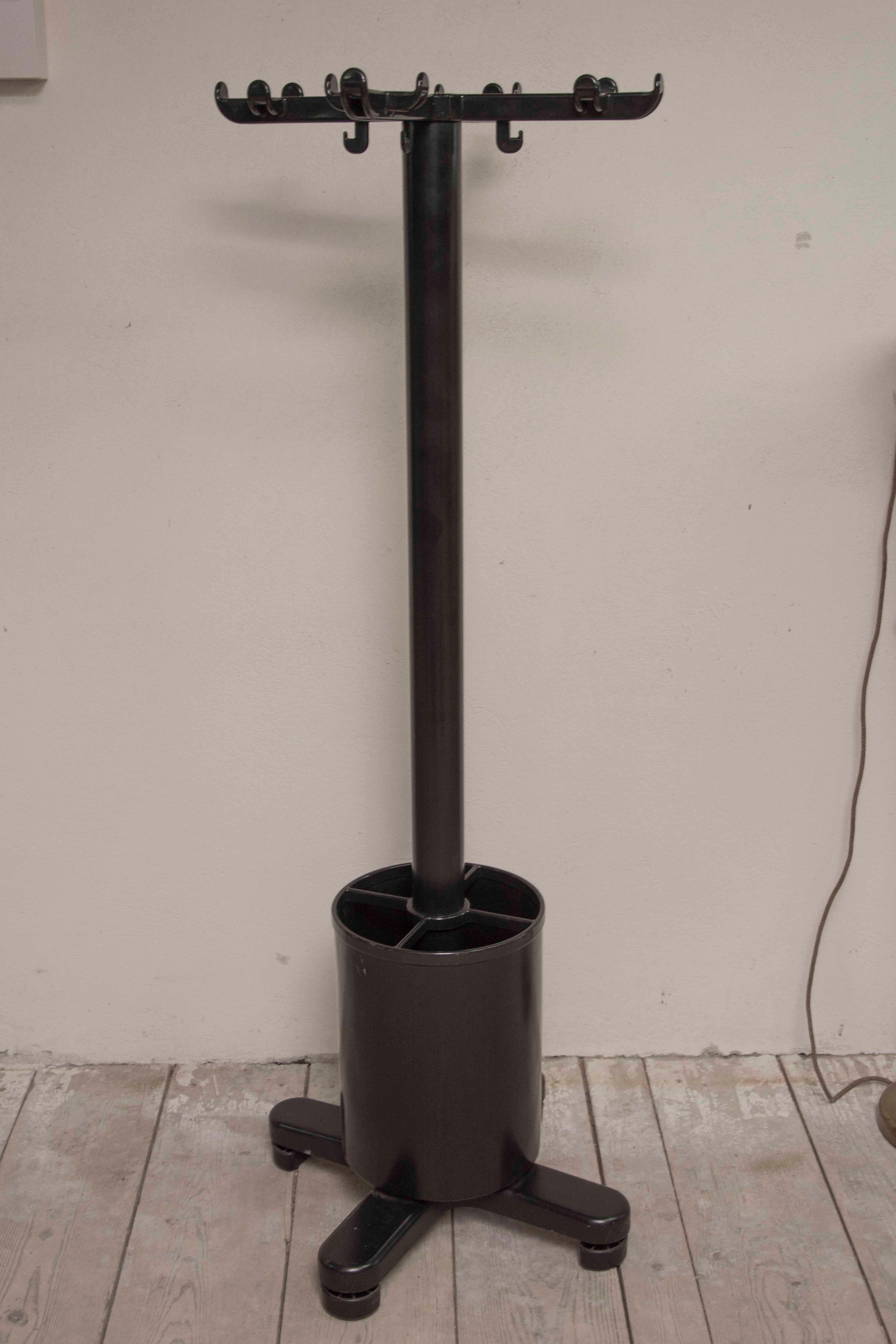 These freestanding coat rack were designed in 1973 by Ettore Sottsass for Olivetti and produced in Italy. It features an umbrella stand resting on the base. It was constructed of steel, aluminium and plastic. Wear consistent with age and use. It´s a