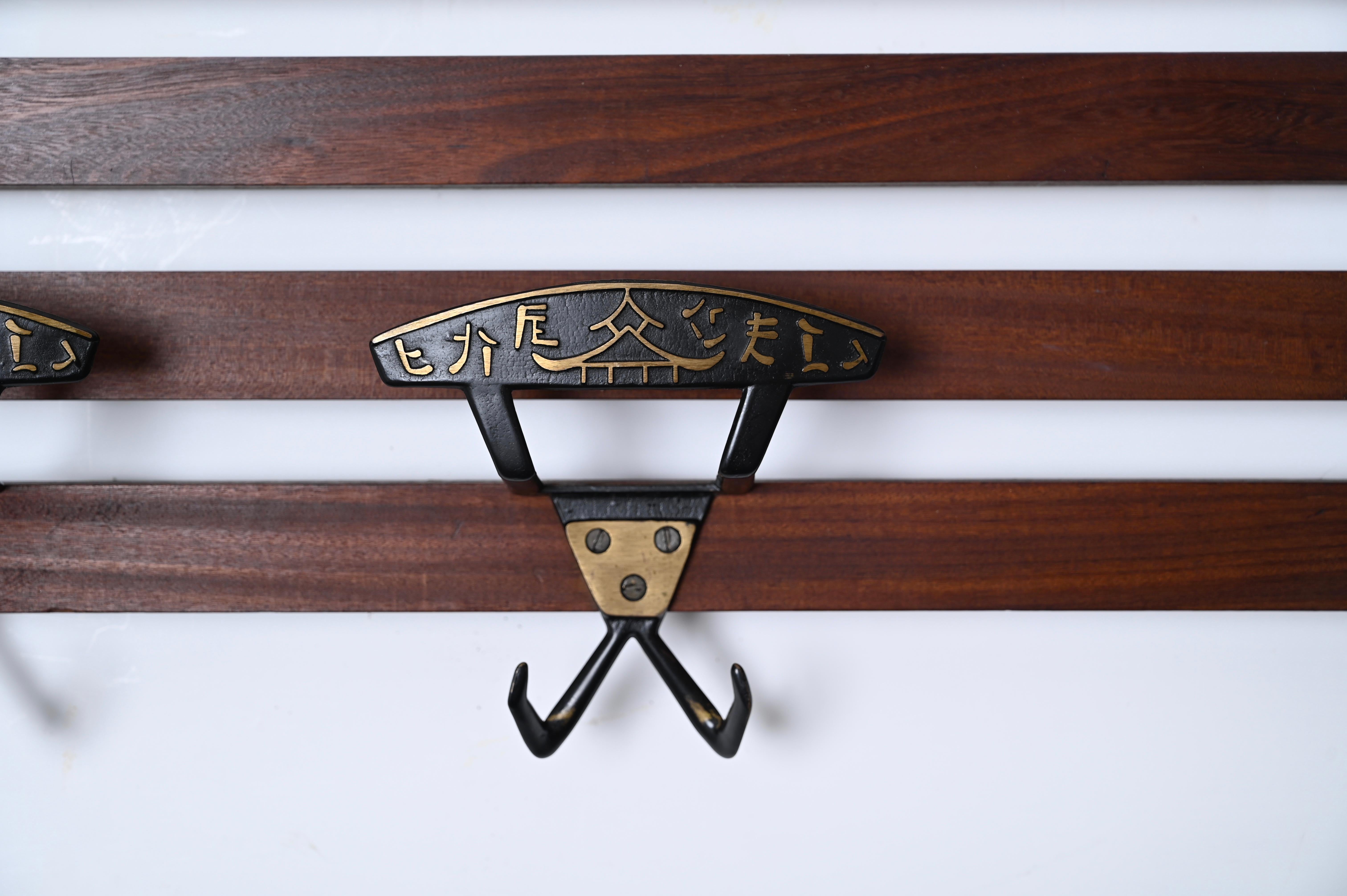 Italian Coat Rack in Teak, Brass and Black Enameled Iron, Italy 1960s In Good Condition For Sale In Roma, IT