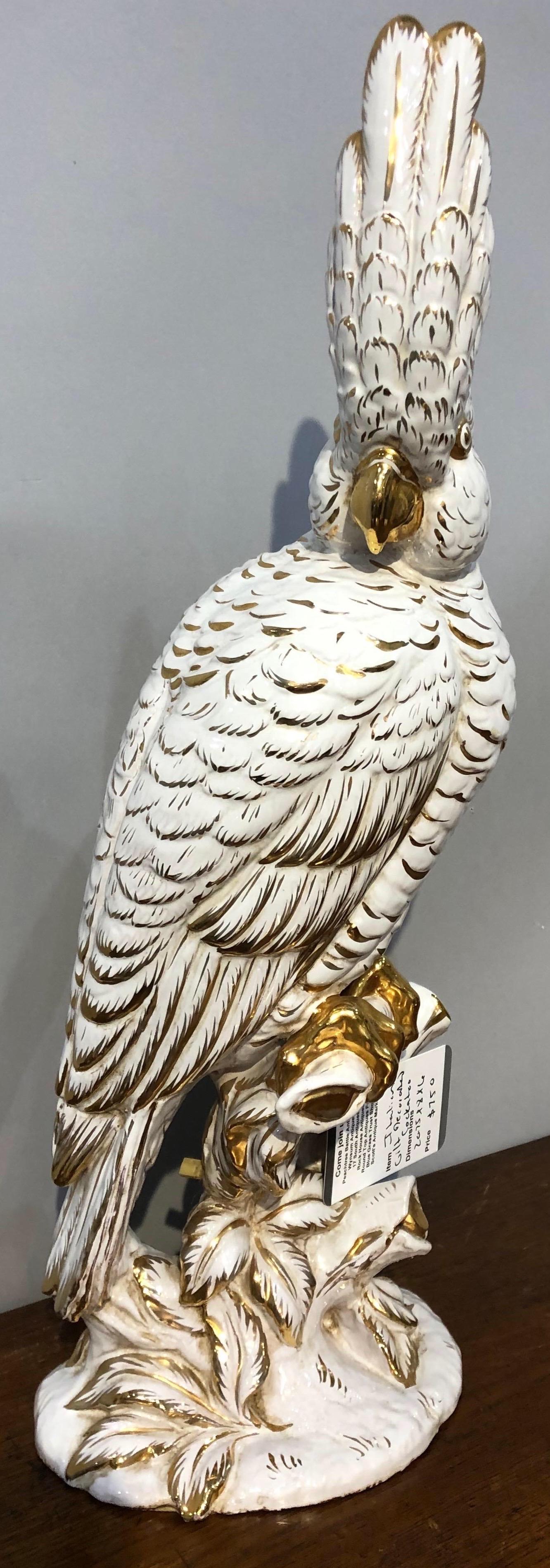 Italian gilt-decorated white glazed perched cockatoo

 Marked 