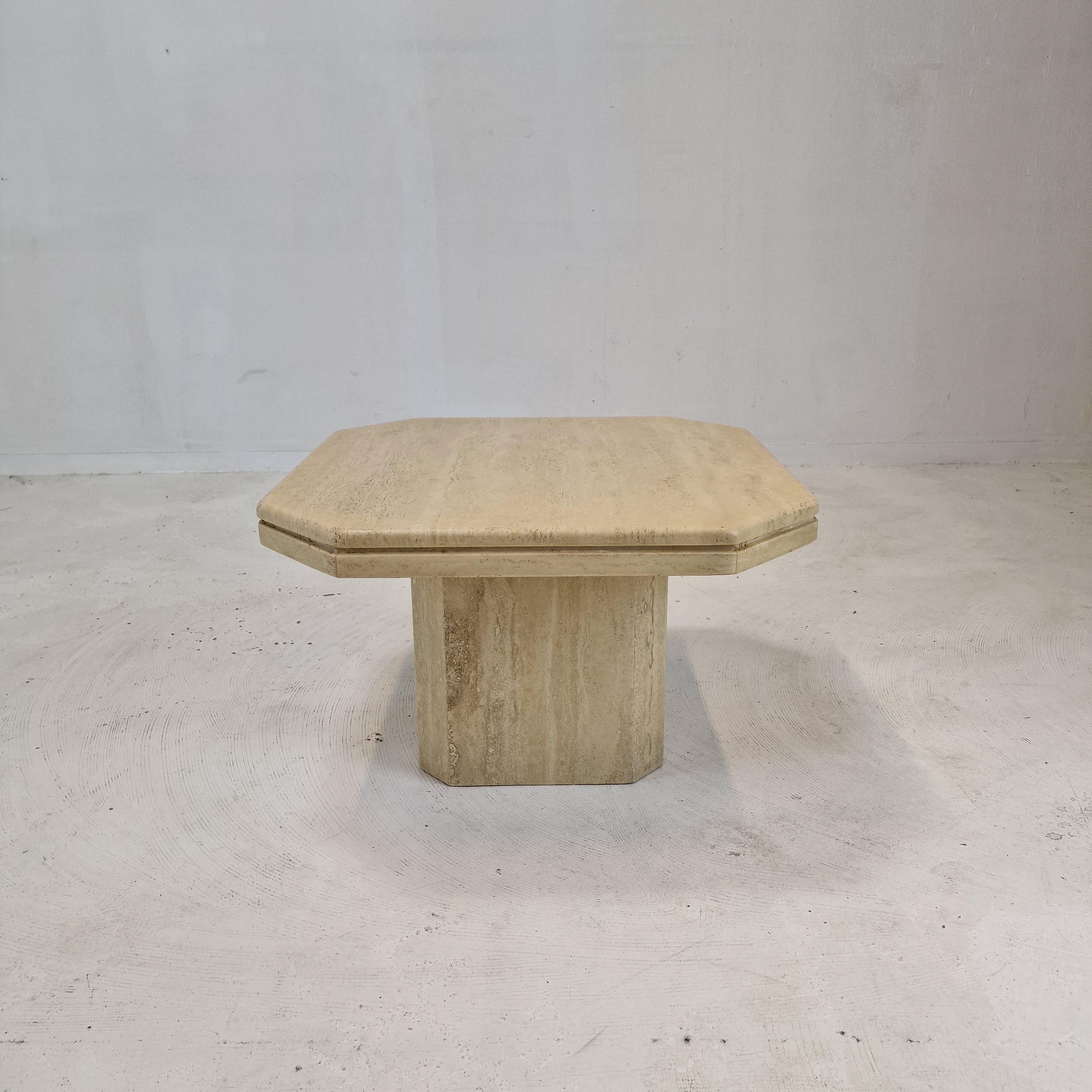 Very nice Italian coffee or side table handcrafted out of travertine, 1980's.

The top is rounded on the edge. 
It is made of beautiful travertine.
Please take notice of the very nice patterns.

It has the normal traces of use, see the
