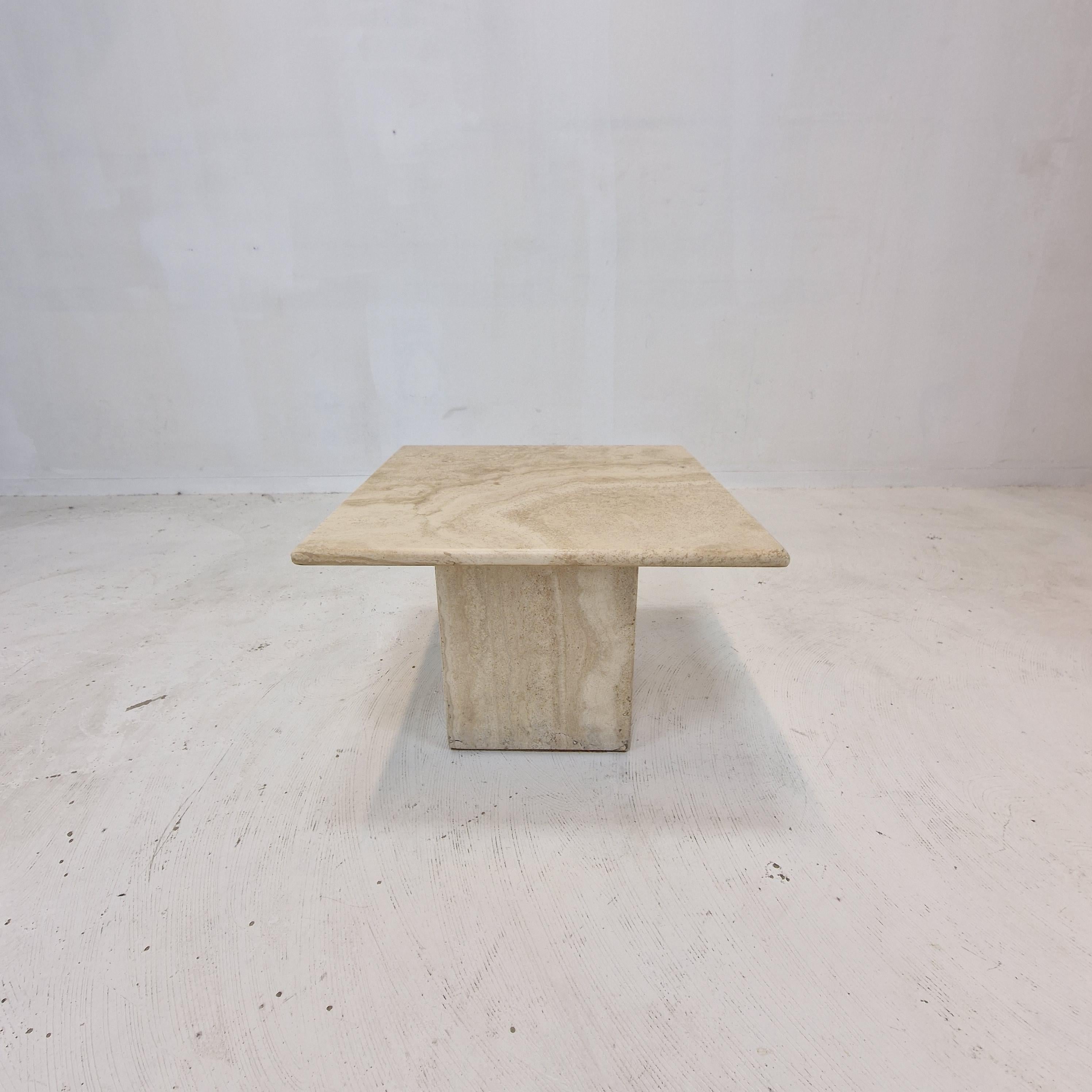 Very nice Italian coffee or side table handcrafted out of travertine, 1980's.

The top is rounded on the edge. 
It is made of beautiful travertine.
Please take notice of the very nice patterns.

It has the normal traces of use, see the