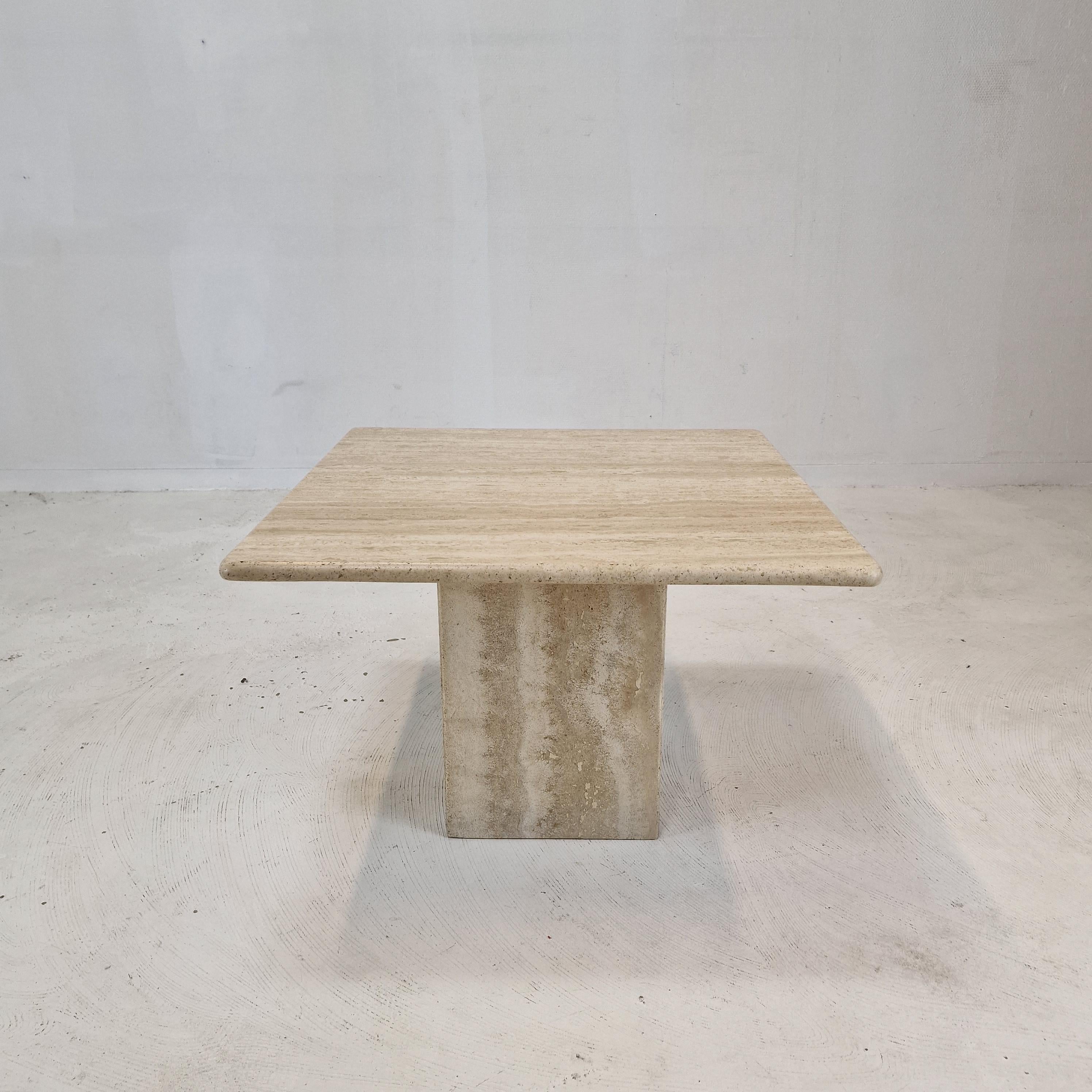 Very nice Italian coffee or side table handcrafted out of travertine, 1980s.

The top is rounded on the edge. 
It is made of beautiful travertine.
Please take notice of the very nice patterns.

It has the normal traces of use, see the