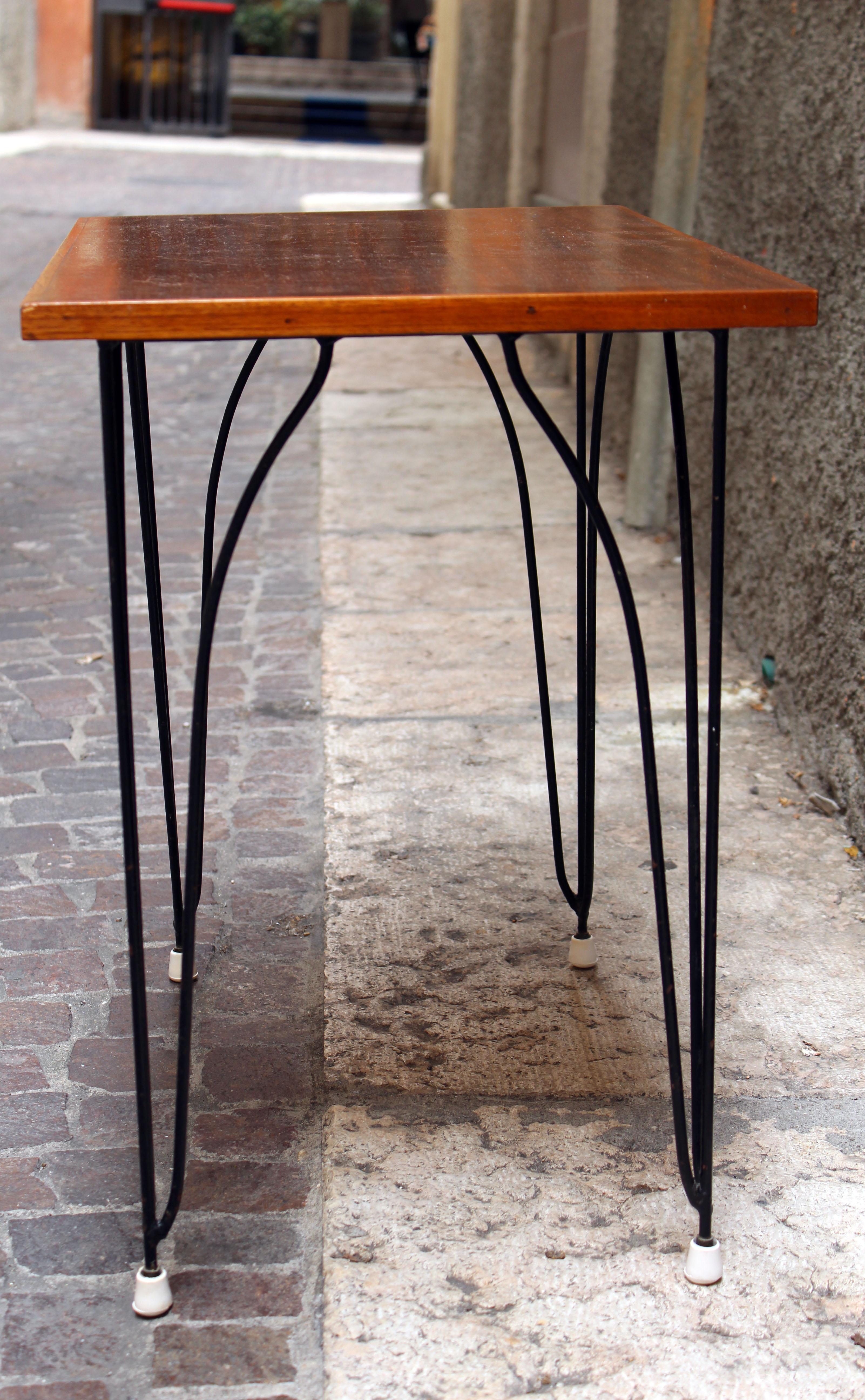 Coffee table made of wood and iron.
Made in Italy, circa 1960.