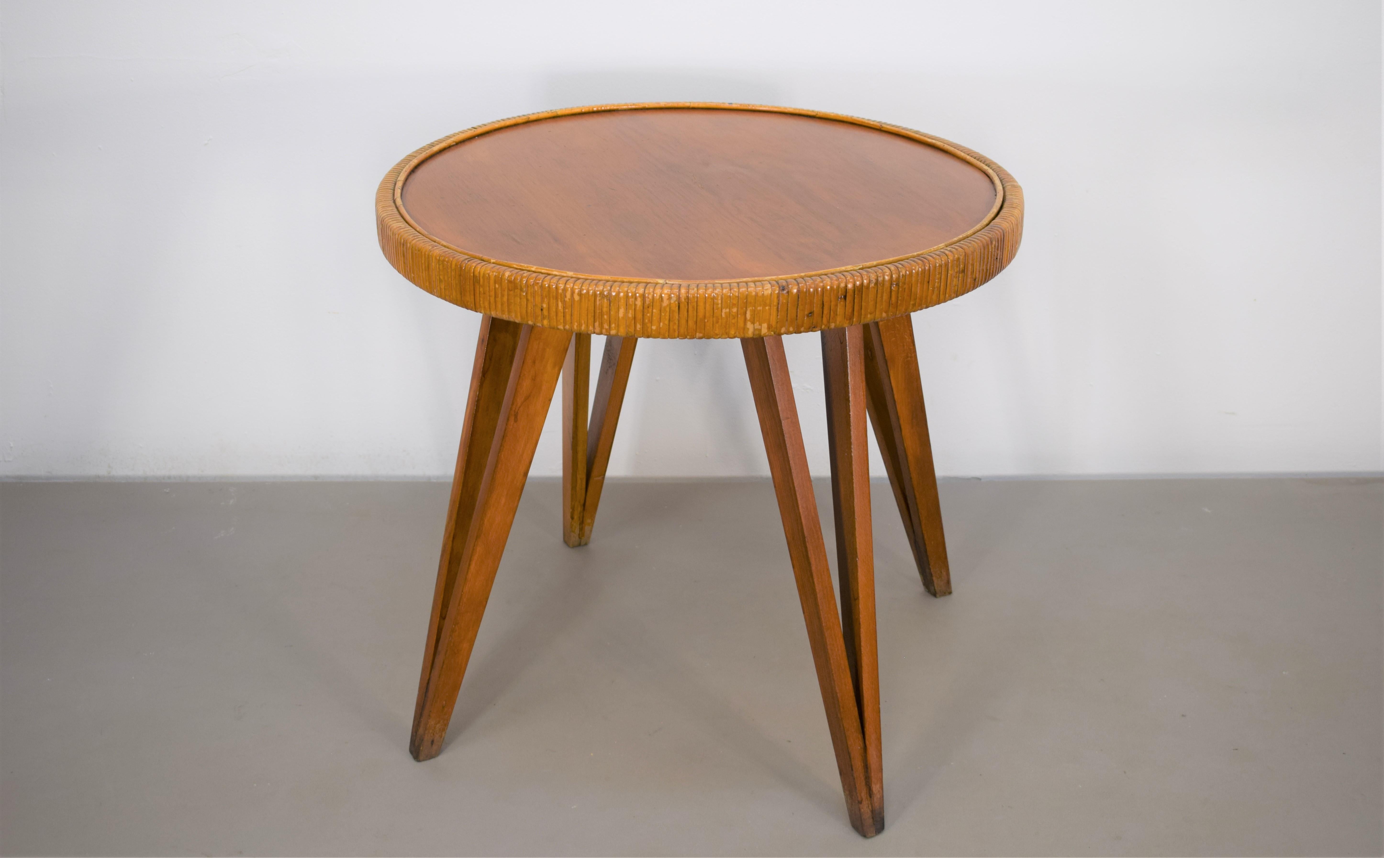 Italian coffee table by Augusto Romano, 1940s.

Dimensions: H= 60 cm; D= 66 cm.