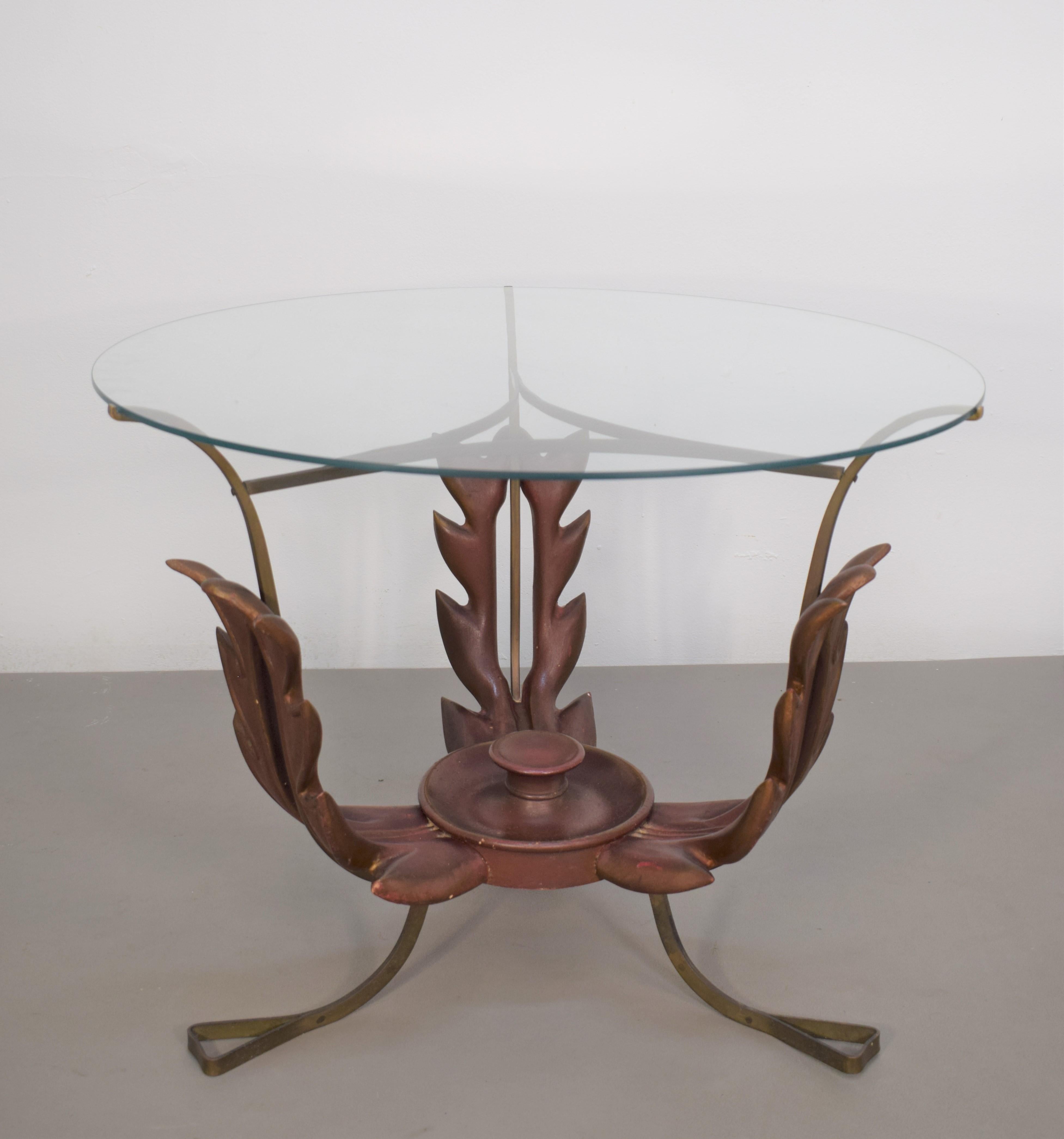 Italian coffee table by Pier Luigi Colli, brass, wood and glass, 1940s.

Dimensions: H= 51cm; D=66 cm.