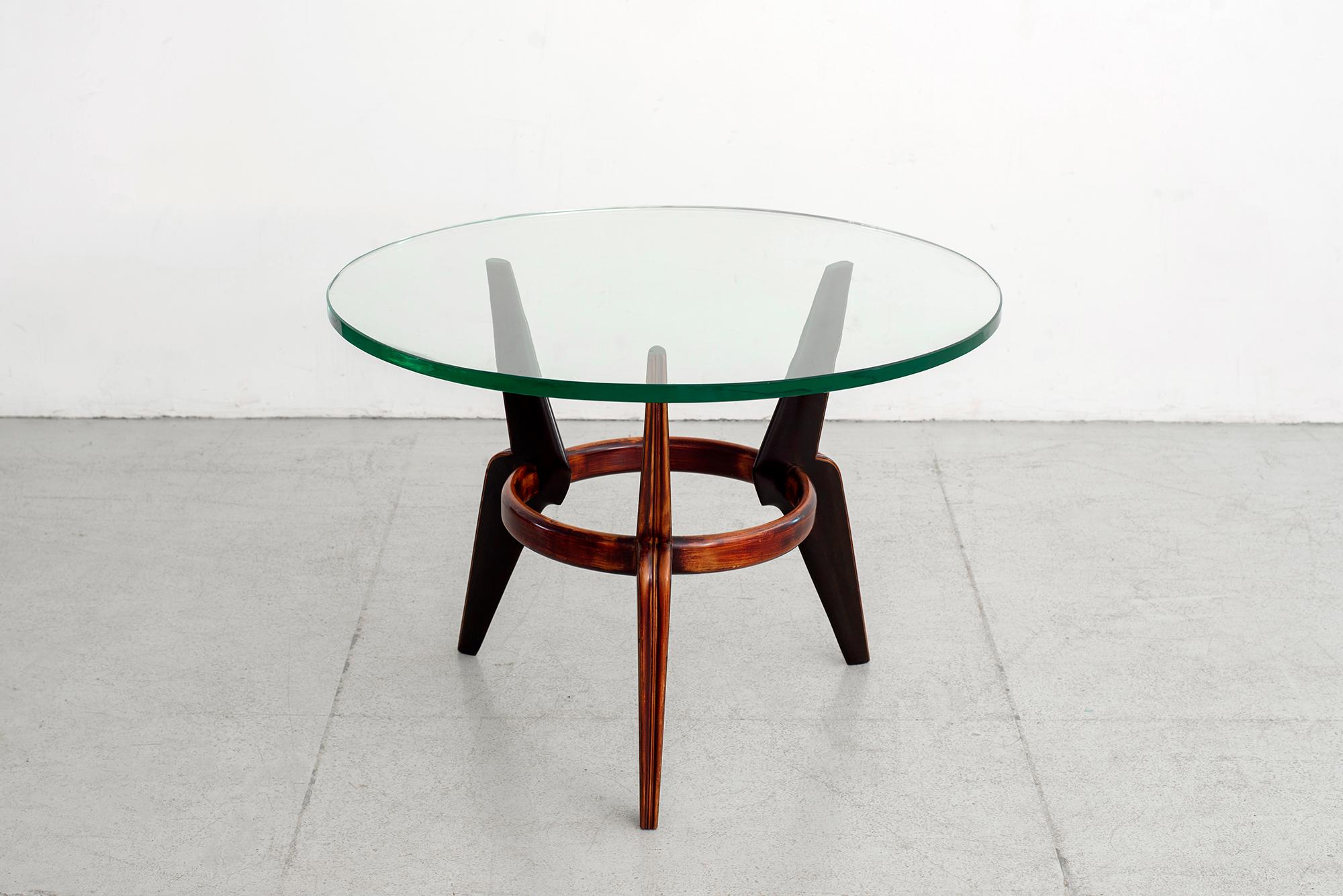 Beautiful 1940s Italian circular coffee table with three legs and glass top. 
Mahogany wood with wonderful original finish.