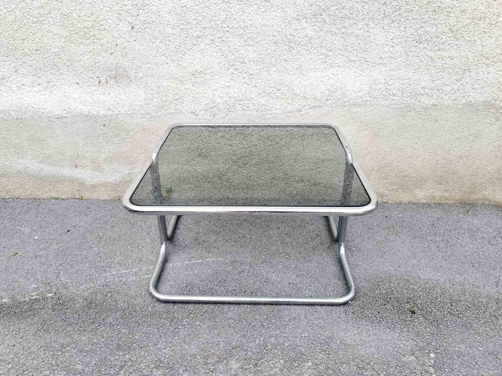 Italian coffee or side table in bauhaus style, made in Italy in the 60s.
Smoked glass surface.
In very good vintage condition.