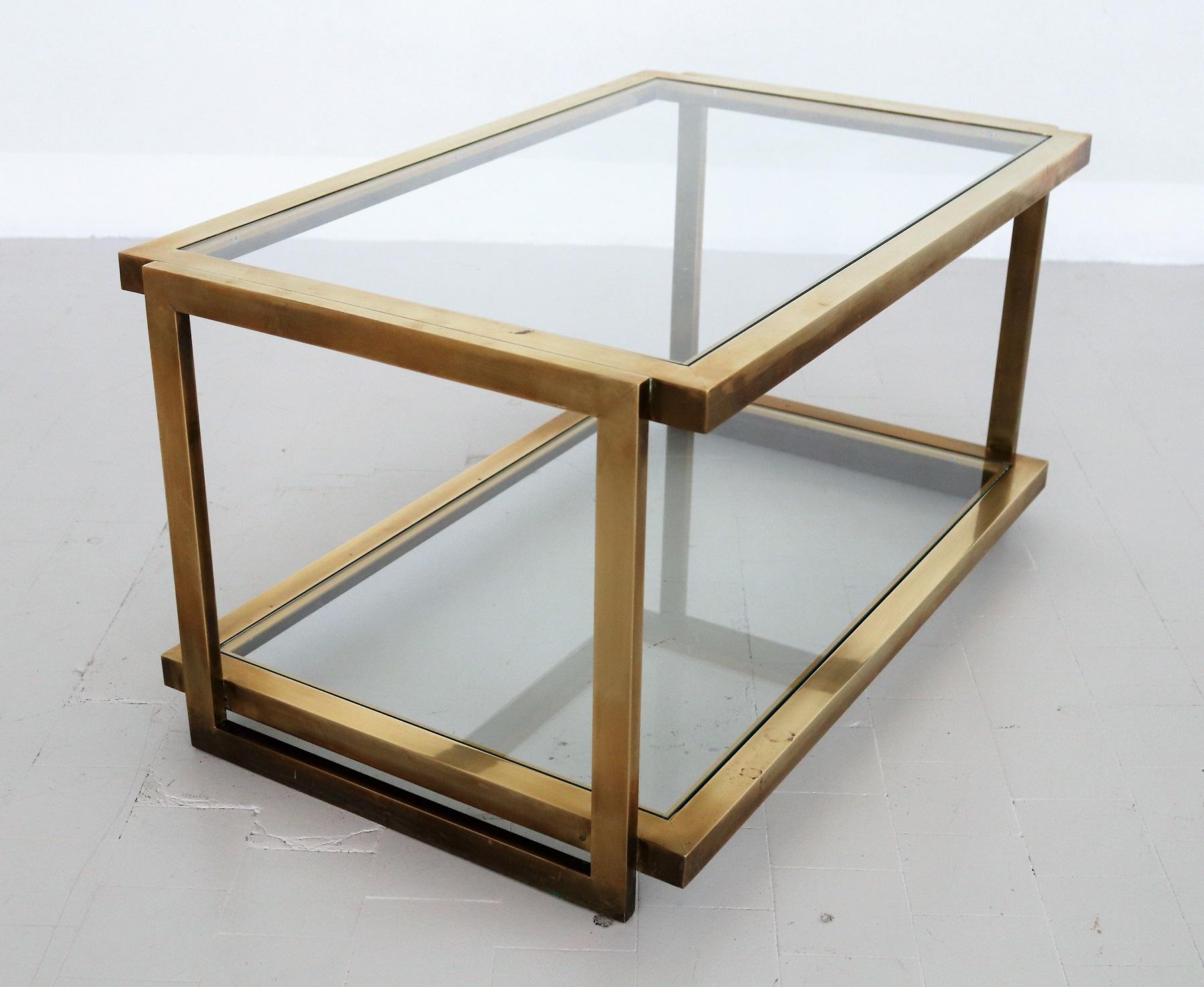 Gorgeous coffee table, Made in Italy in the 1970s.
Made of strong Brass with beautiful dark original patina, and two glass shelves.
Very good vintage condition, no defects.

 