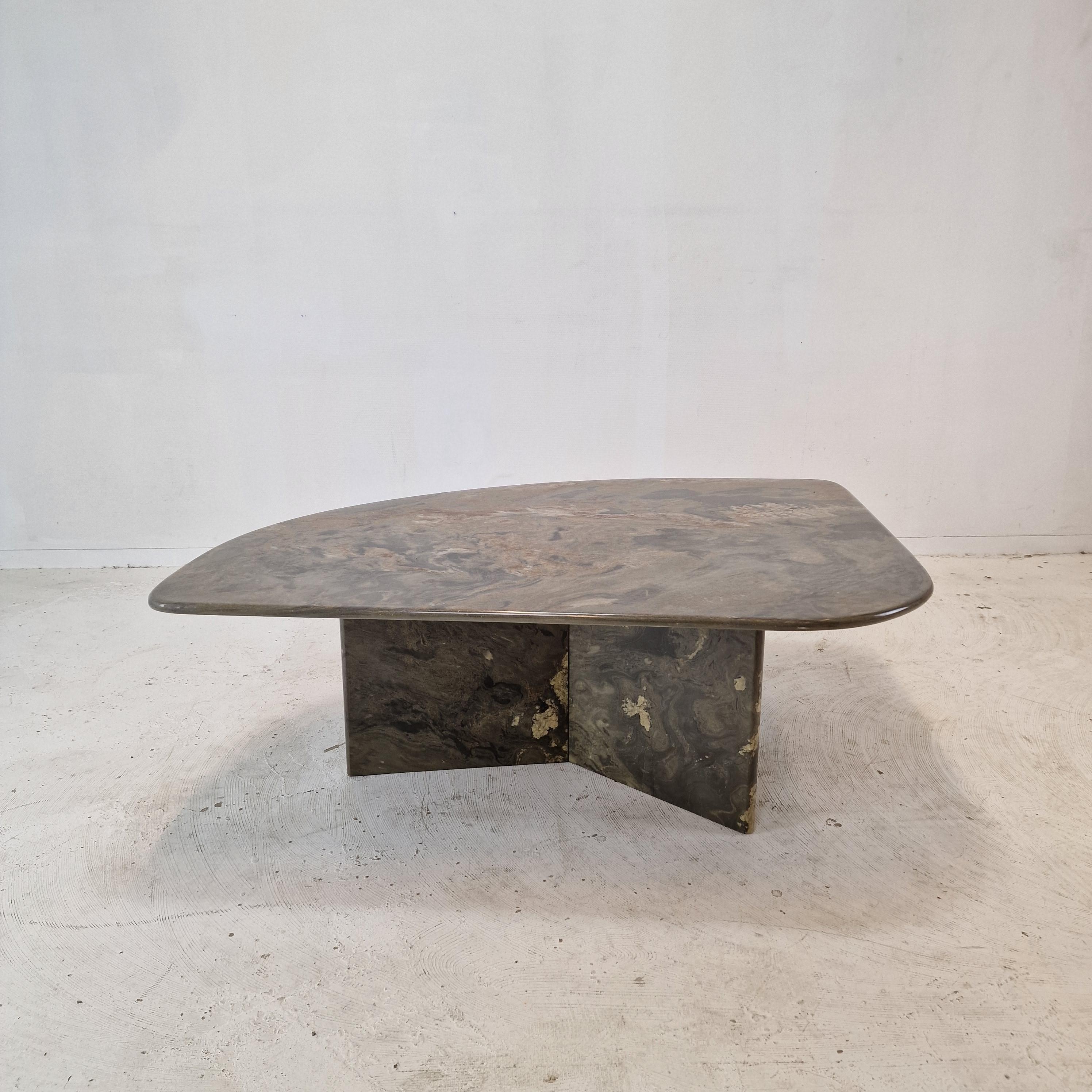 Very nice Italian coffee or side table handcrafted out of granite, 1980s.

It has a very nice 3-leg base and a triangle plate.
It is made of beautiful granite.
Please take notice of the very nice patterns.
It has the normal traces of use, see the