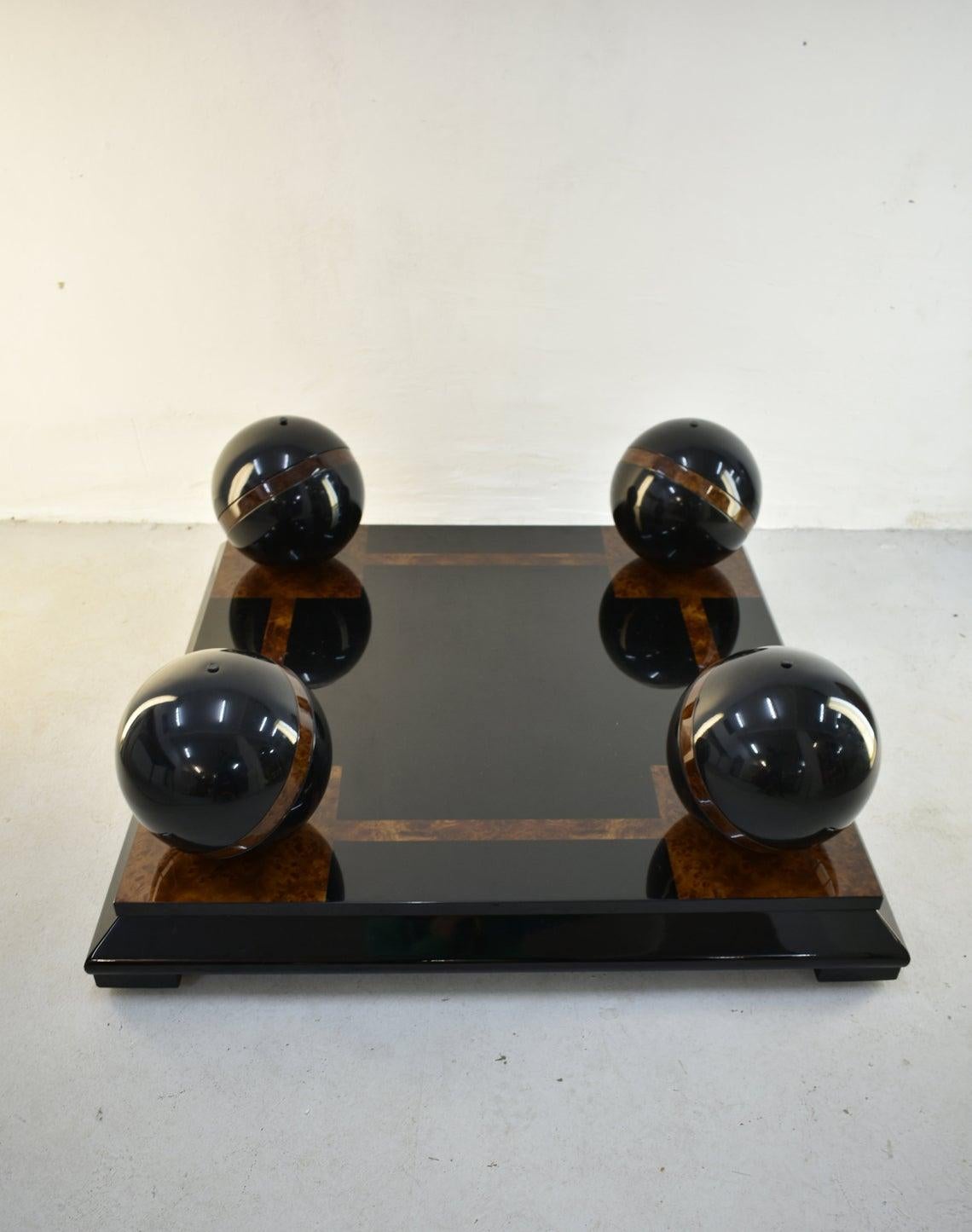 Stunning luxury Italian coffee table from 1970s

Base is made of black lacquered wood with details in burl wood

Base has casters, 4 large spheres are made of black metal with burl wood details

Large glass top stands freely on 4