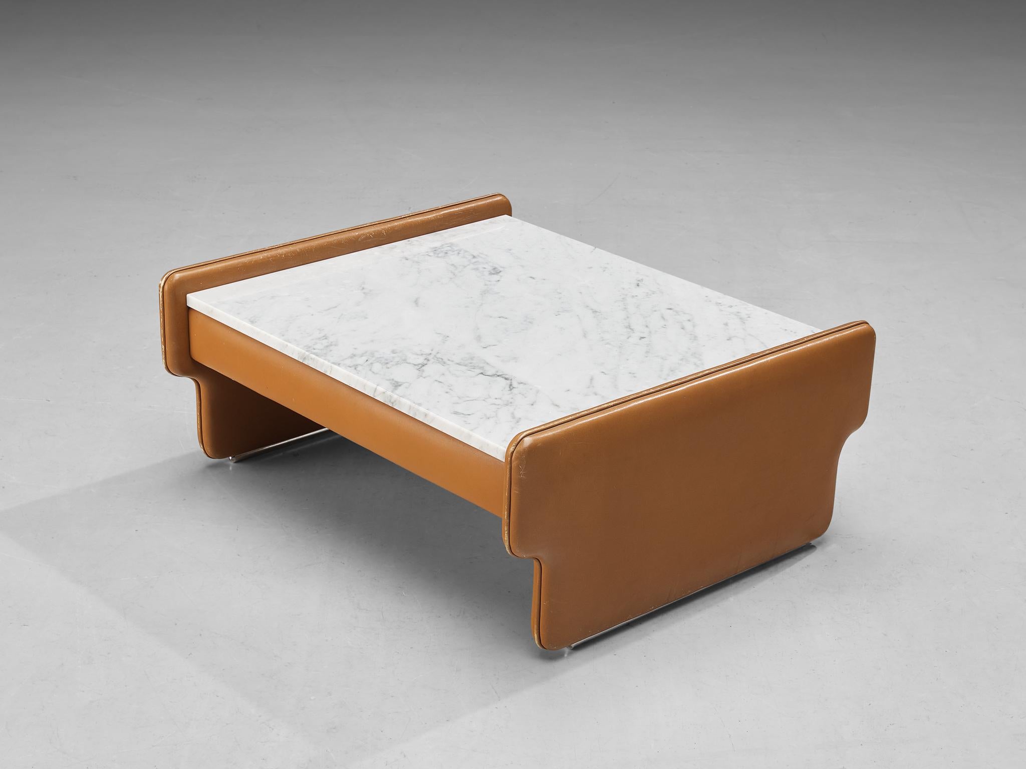 Coffee table, leather, Carrara marble, Italy, 1970s. 

This coffee table truly radiates Italian design of the seventies. The use of soft cognac leather combined with striking geometric forms is highly notable and characteristic for that era. The