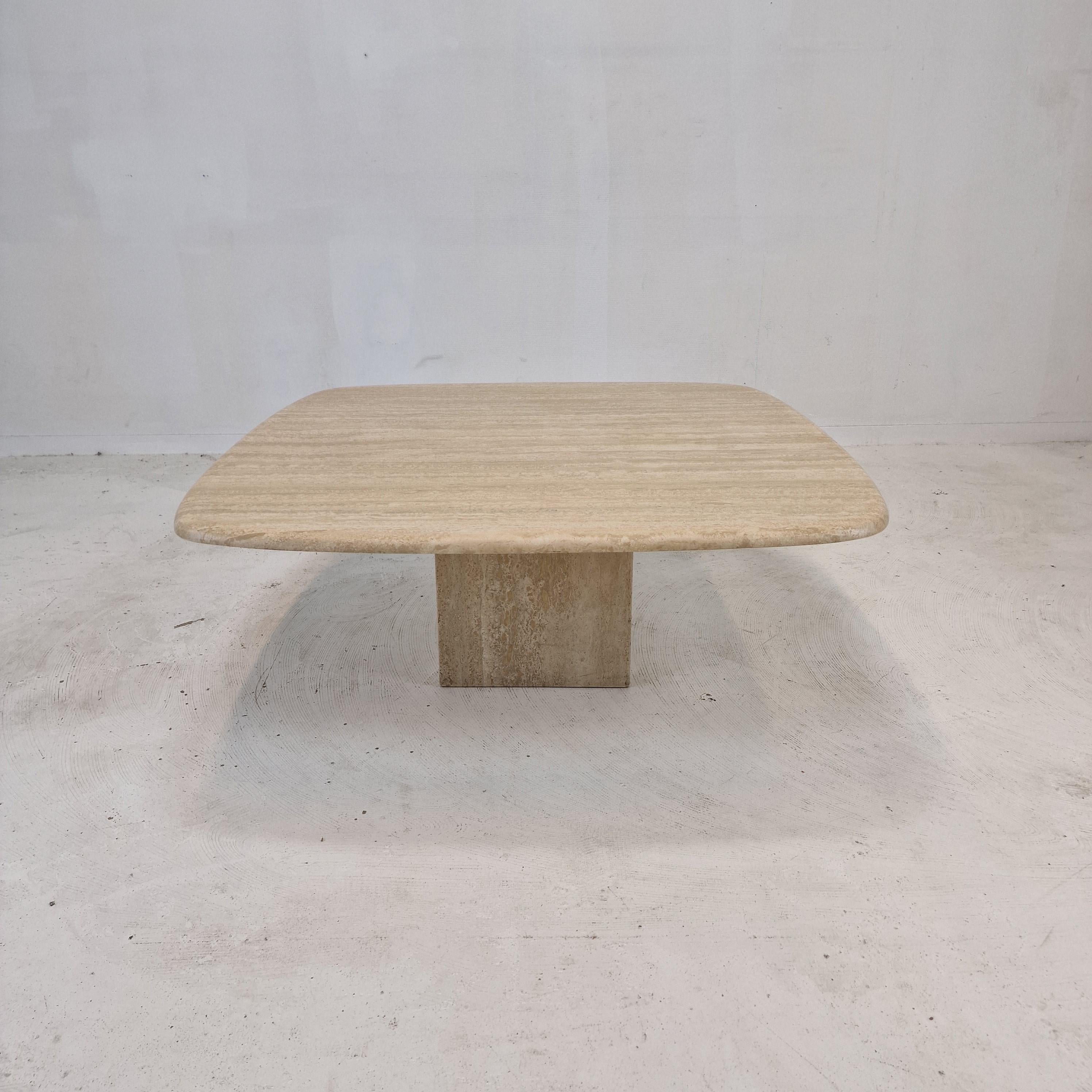 Very nice Italian coffee or side table handcrafted out of travertine, 1980s.

The top is rounded on the edge. 
It is made of beautiful travertine.
Please take notice of the very nice patterns.

It has the normal traces of use, see the