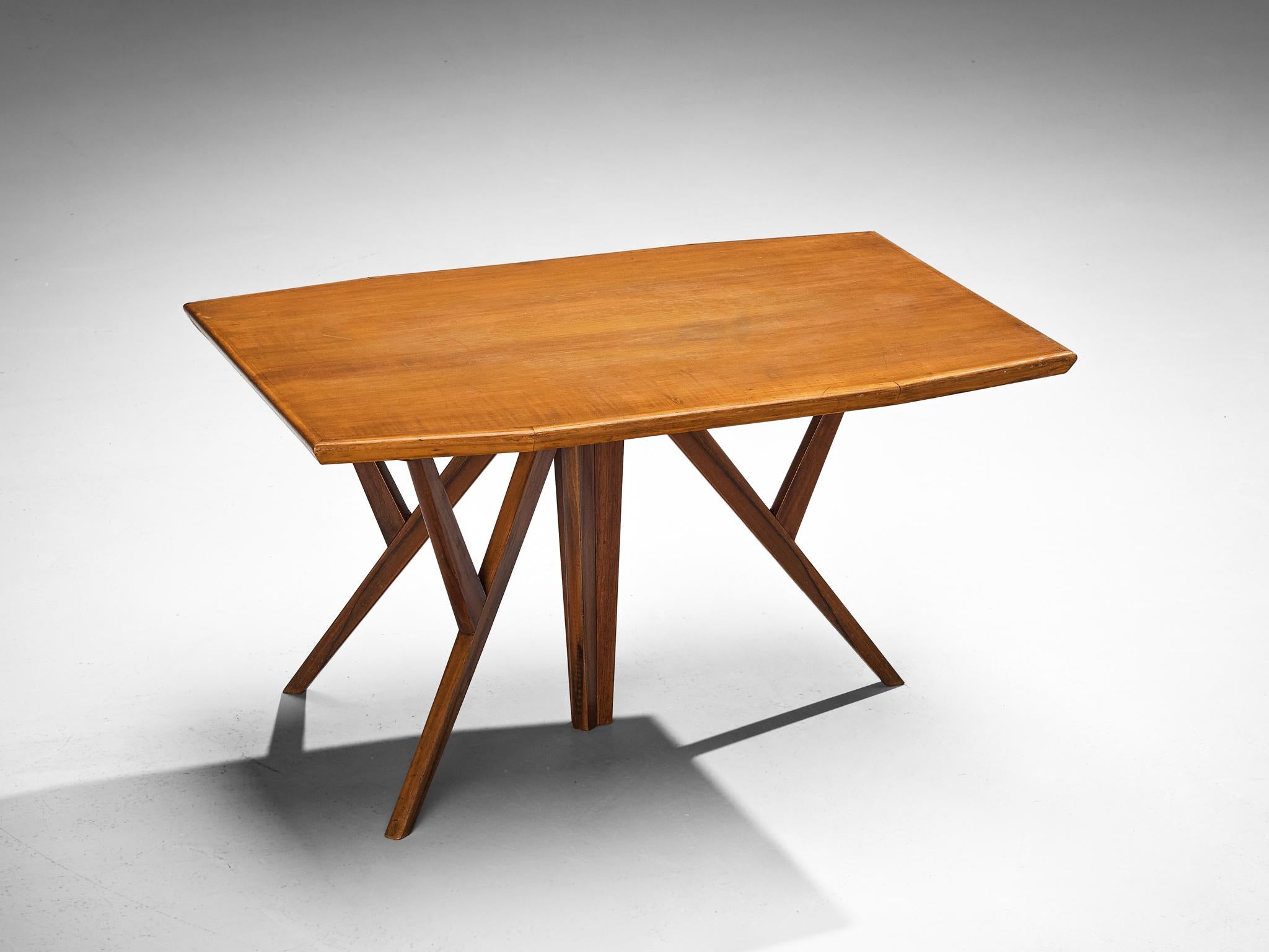 Gustavo & Vito Latis, coffee table, walnut, Italy, circa 1960

A truly exceptional coffee table of Italian origin, employing 1950s and 1960s Mid-Century Modern aesthetic vocabulary and typical woodwork of that period. The tabletop is shaped in a