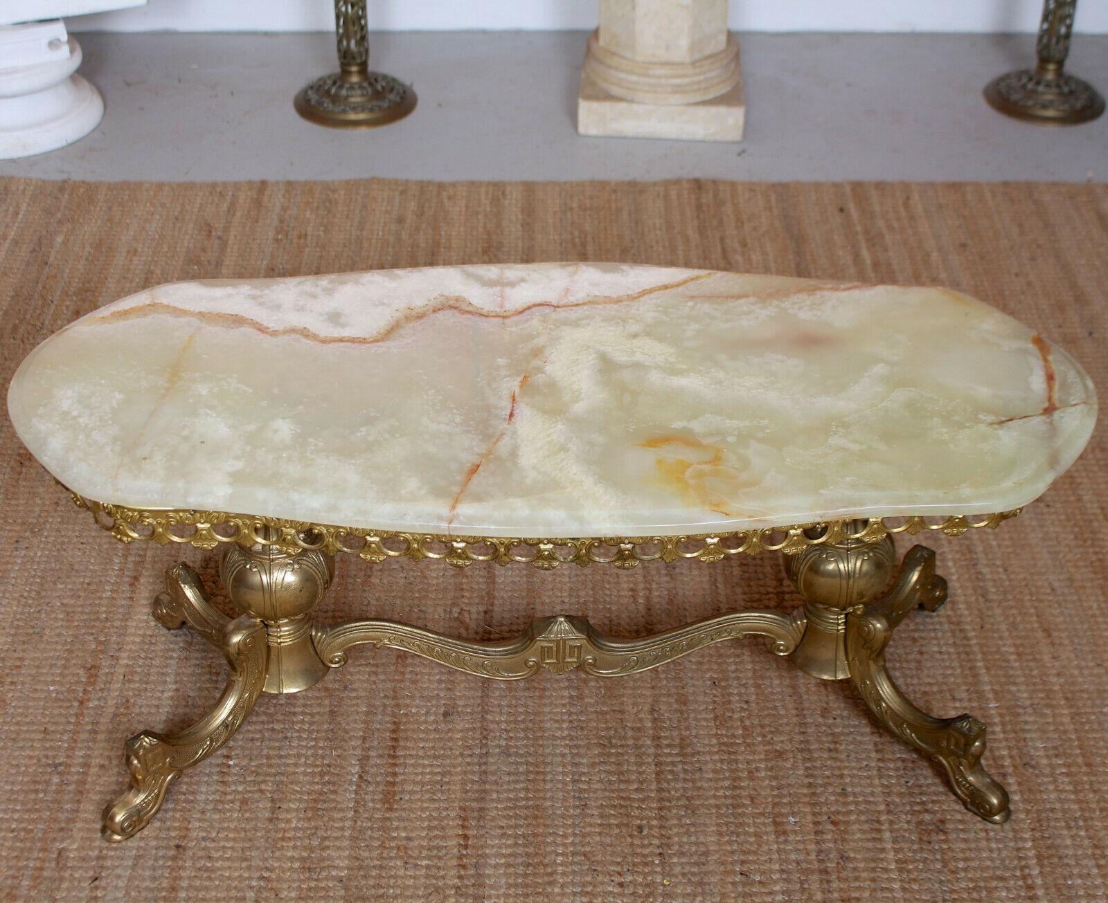 A fine quality 20th century Italian coffee table in the Rococo manner.
The brass base features a pierced gallery apron decorated with scrolls and acanthus motif and raised on capped scrolled feet.
Warm-toned and loaded with visual textures, the