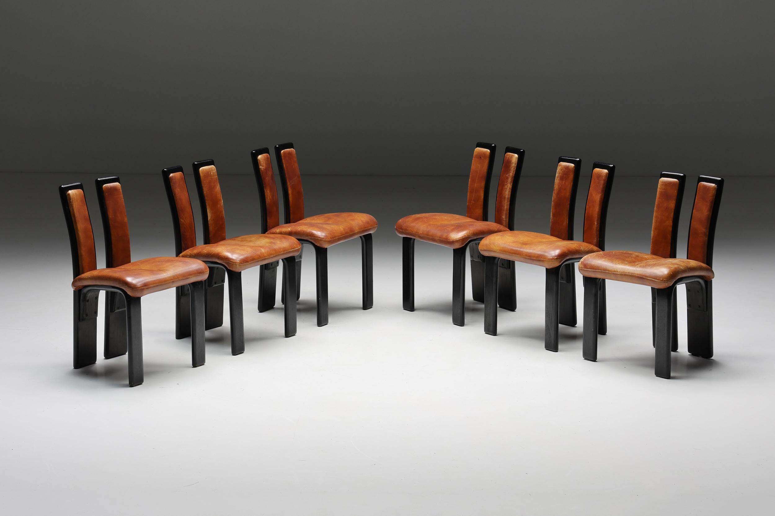 Italian; Cognac; leather; dining chairs; 1980s; Italian Design; Postmodern; Mid-Century Modern; Scarpa; Afra & Tobia Scarpa; Italy; 

Italian cognac leather dining chairs from the 1980s. Dining chairs with a remarkable back which is divided into