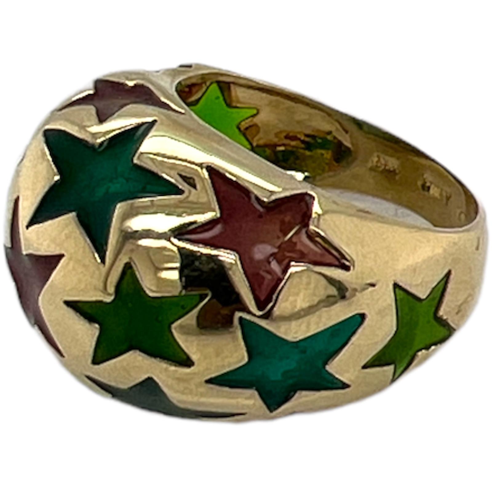 Fabulous vintage enamel dome ring crafted in 14 karat yellow gold. The ring features green, blue, and red enamel stars spread out over the dome of the ring. The ring measures 15mm in width, and is currently size 8.5 (can be sized). 