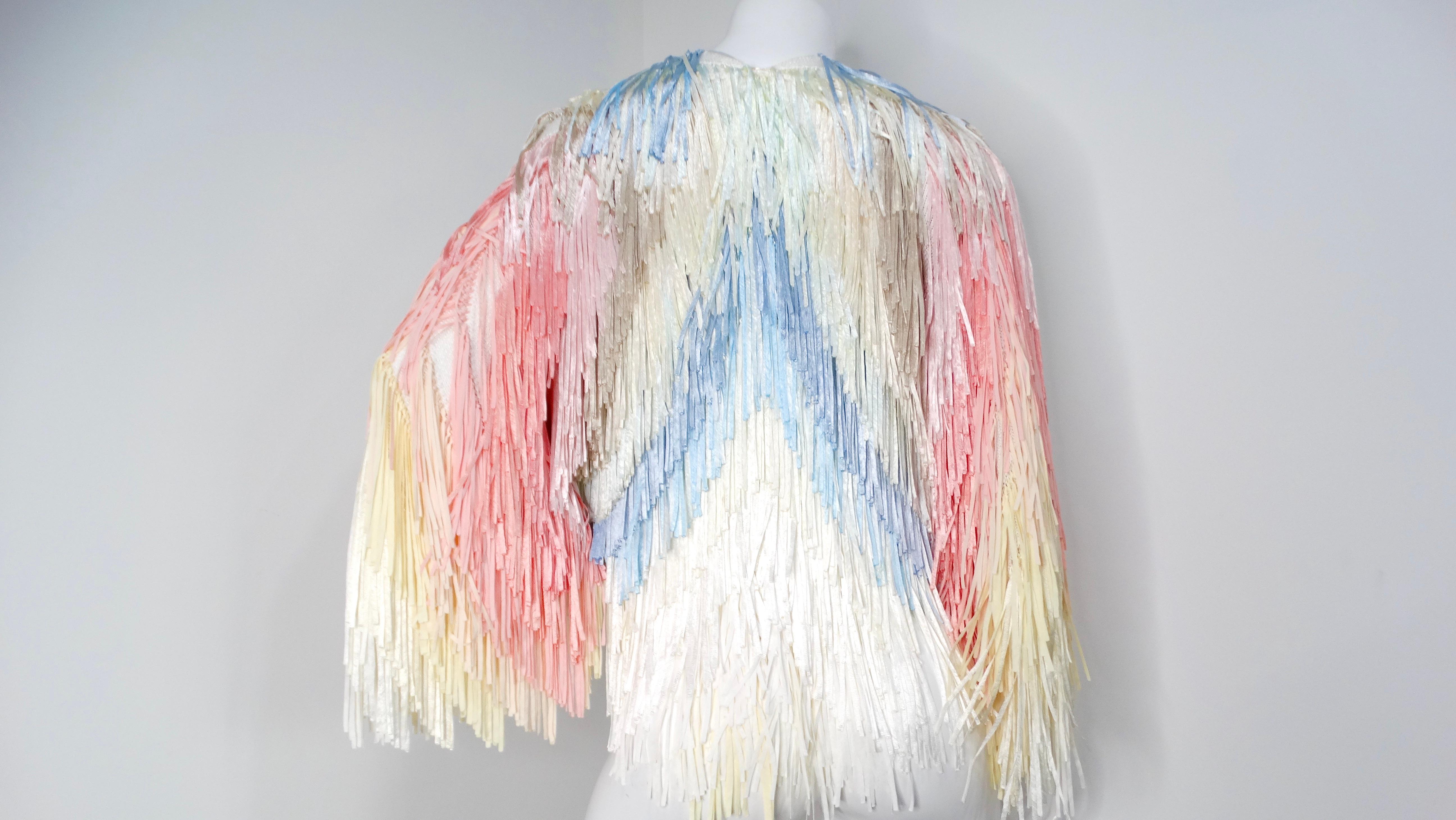 Introducing the Italian Colorful Pastel Silk Ribbon Fringe Crochet Jacket, purchased in Florence, a dazzling piece that radiates vibrancy and playful elegance. This open jacket features a beautifully crafted crochet knit base, completely adorned