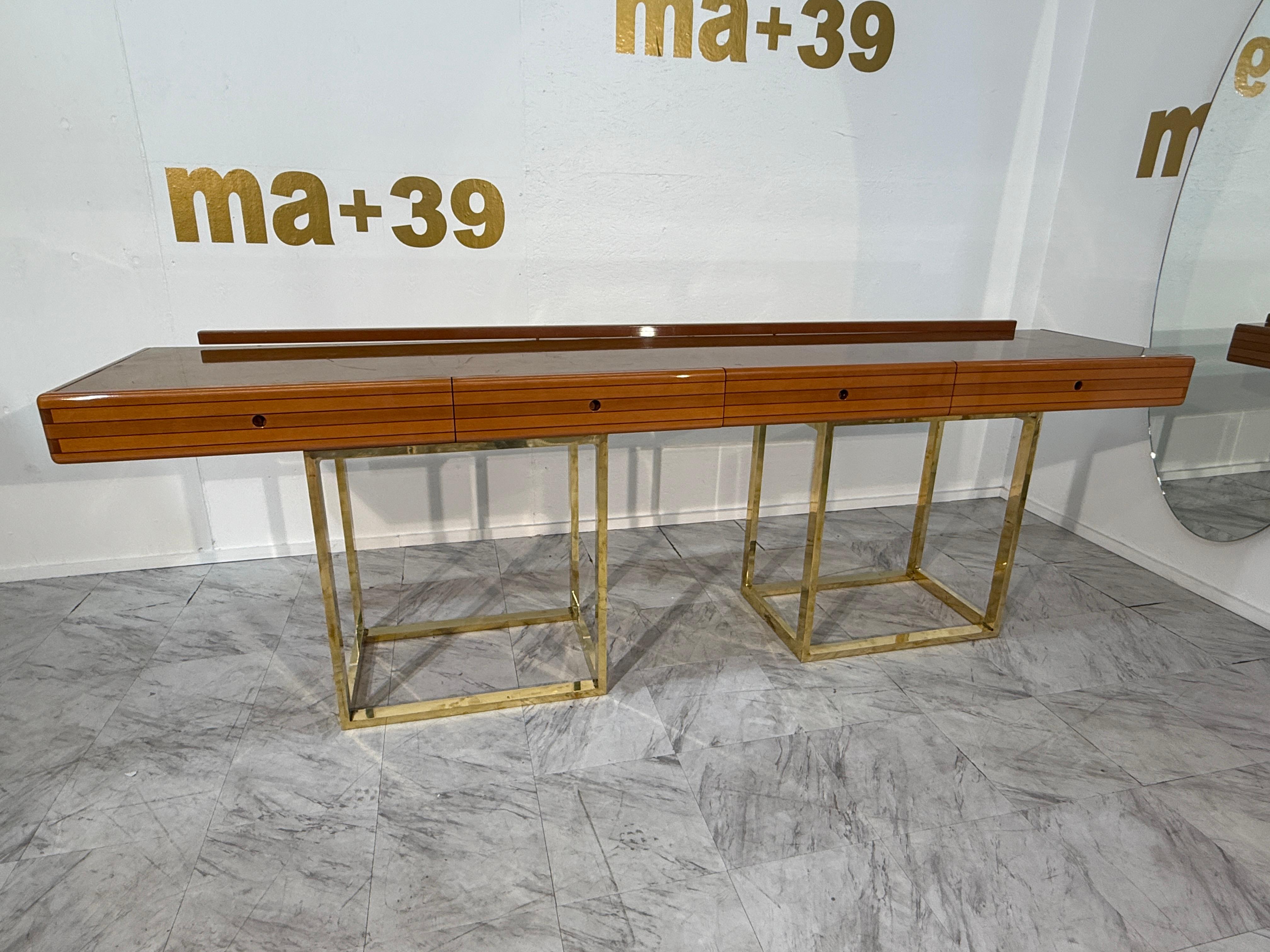 Elegant 1970s Italian console by Afra & Tobia Scarpa, featuring a sleek wooden top with four hidden drawers and a raised back edge. The warm wood contrasts with a geometric brass-plated base, combining minimalism with refined luxury. Perfect as an