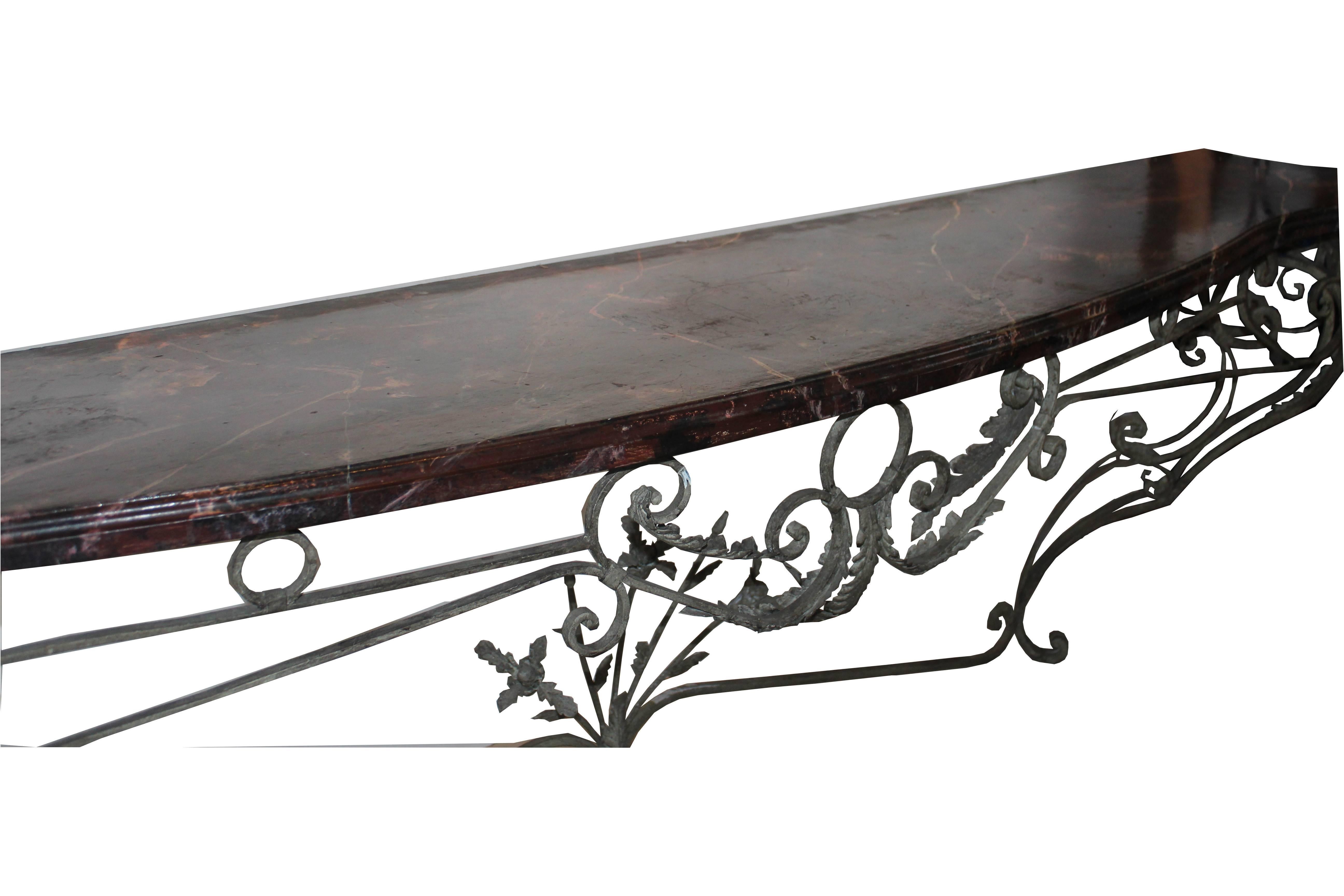 Iron console base with faux-marble finish top.