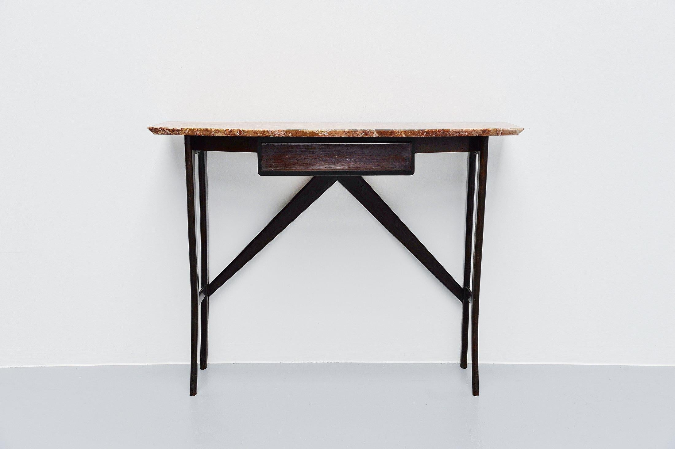 Fantastic shaped Italian console table made by unknown designer and manufacturer but in the style of Ico Parisi, Italy, 1950. This is for a gloss dark brown ebonized beech wooden console with pink/orange marble top. This fantastic shaped console