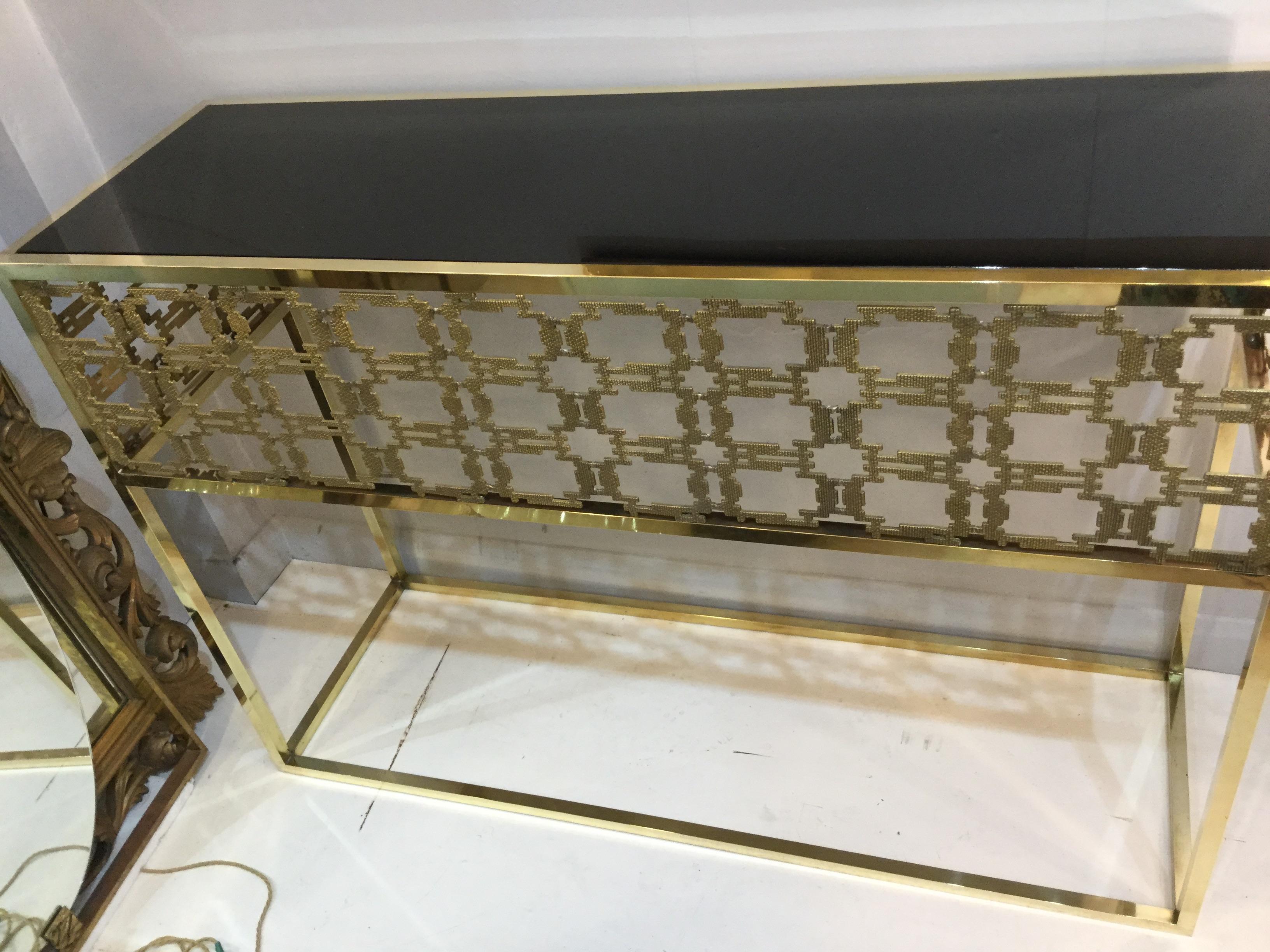 Italian console table in brass the style of Frigerio, circa 1980.
Two available.