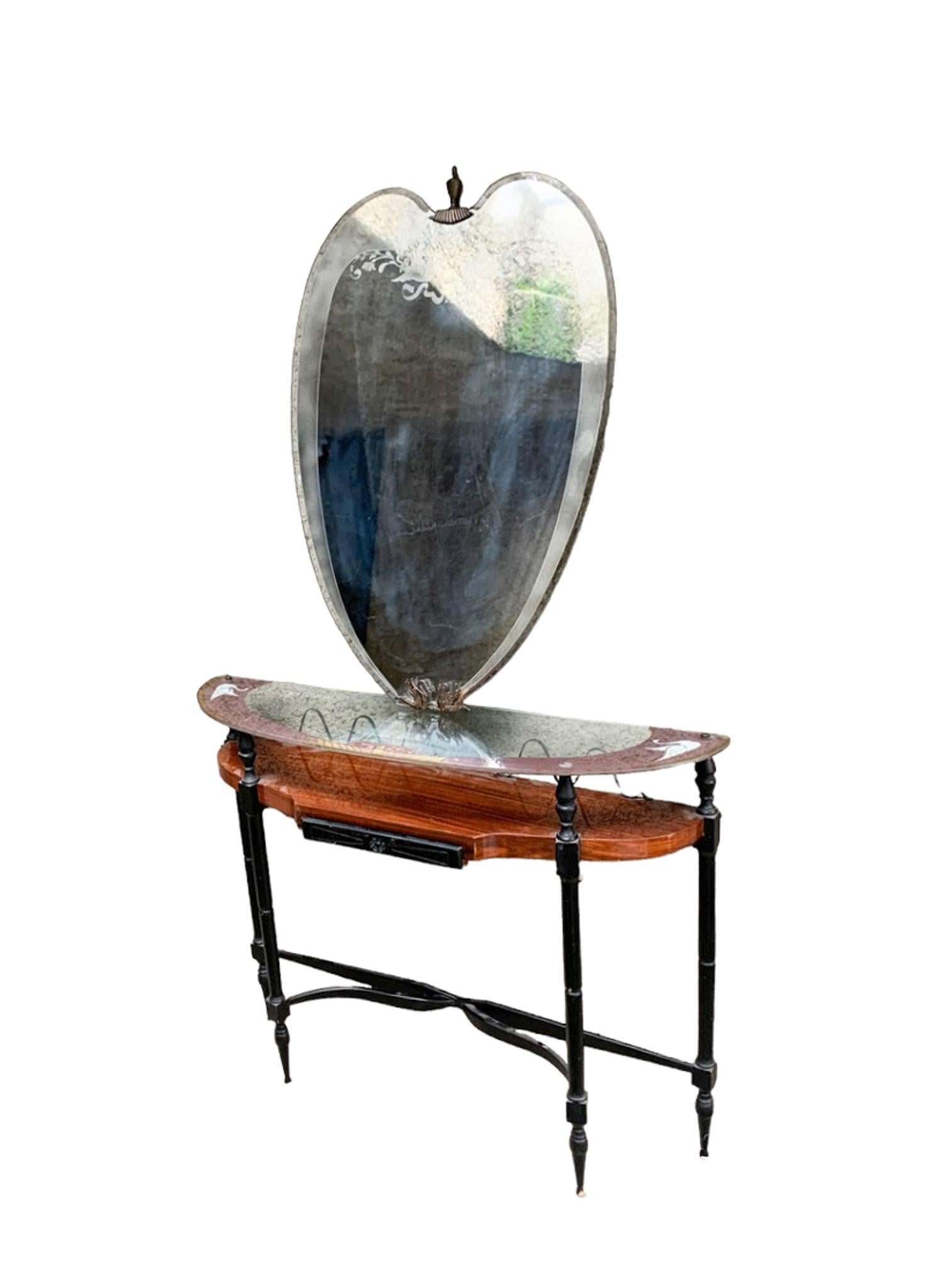 Italian Console with decorated mirror made in the 1950s

here are the dimension of the two pieces: 

Table Console: Ø 102 cm Ø cm 28 h cm 82

Wall Mirror:  Ø cm 87 h cm 107

The Console table is made of wood, iron and the top is made of glass