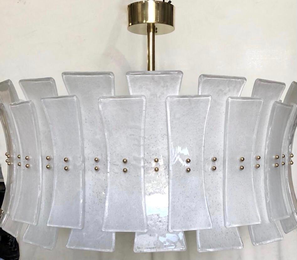 A contemporary Italian bespoke modern chandelier with Art Deco Design, entirely handcrafted in Italy, customizable as flushmounts or pendant chandelier with different glass colors and finishes, here with a brass structure in a Minimalist geometric