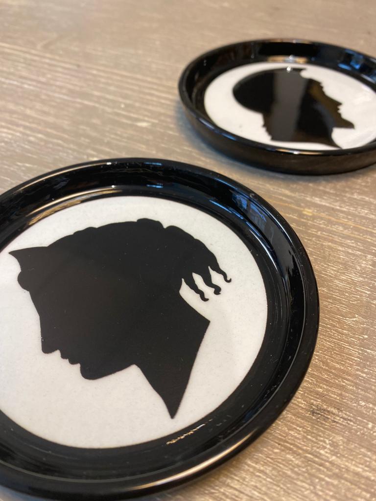 Elegant printed coasters portraying two different ancient black profile on a white background. 

Completely produced in Florence, Italy by Artecornici design. All articles all exclusively conceived and produced by our designers and master