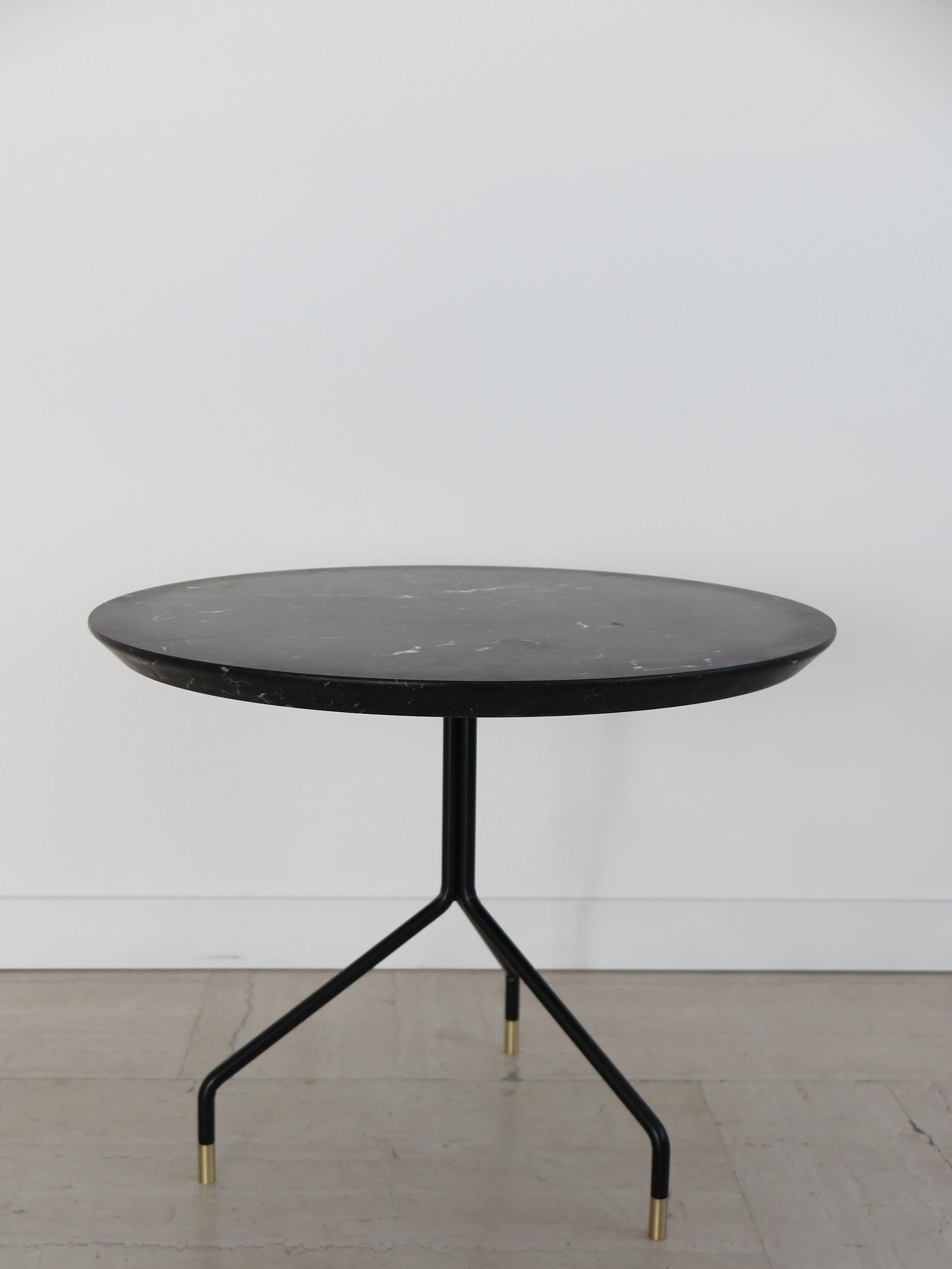 Italian contemporary round coffee table with matt Marquinia Black Marble top and black painted metal structure with brass terminals, new design Capperidicasa, limited edition.

Dimensions: diameter 60 cm - height 48 cm.