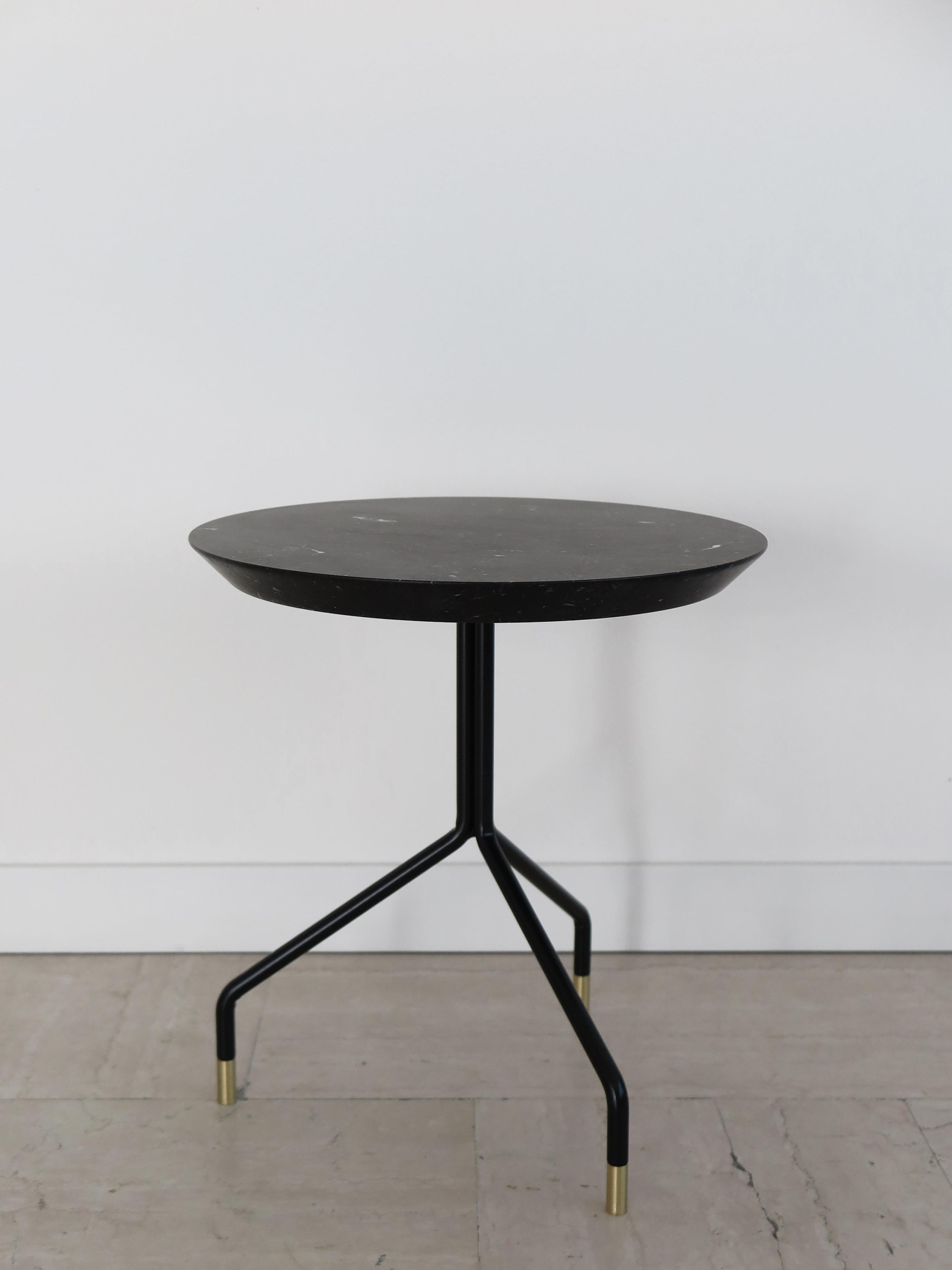 Italian contemporary round coffee table with matt Black Marquinia Marble top and black painted metal structure with brass terminals, new design Capperidicasa, limited edition.

Dimensions: diameter 40 cm - height 43 cm.