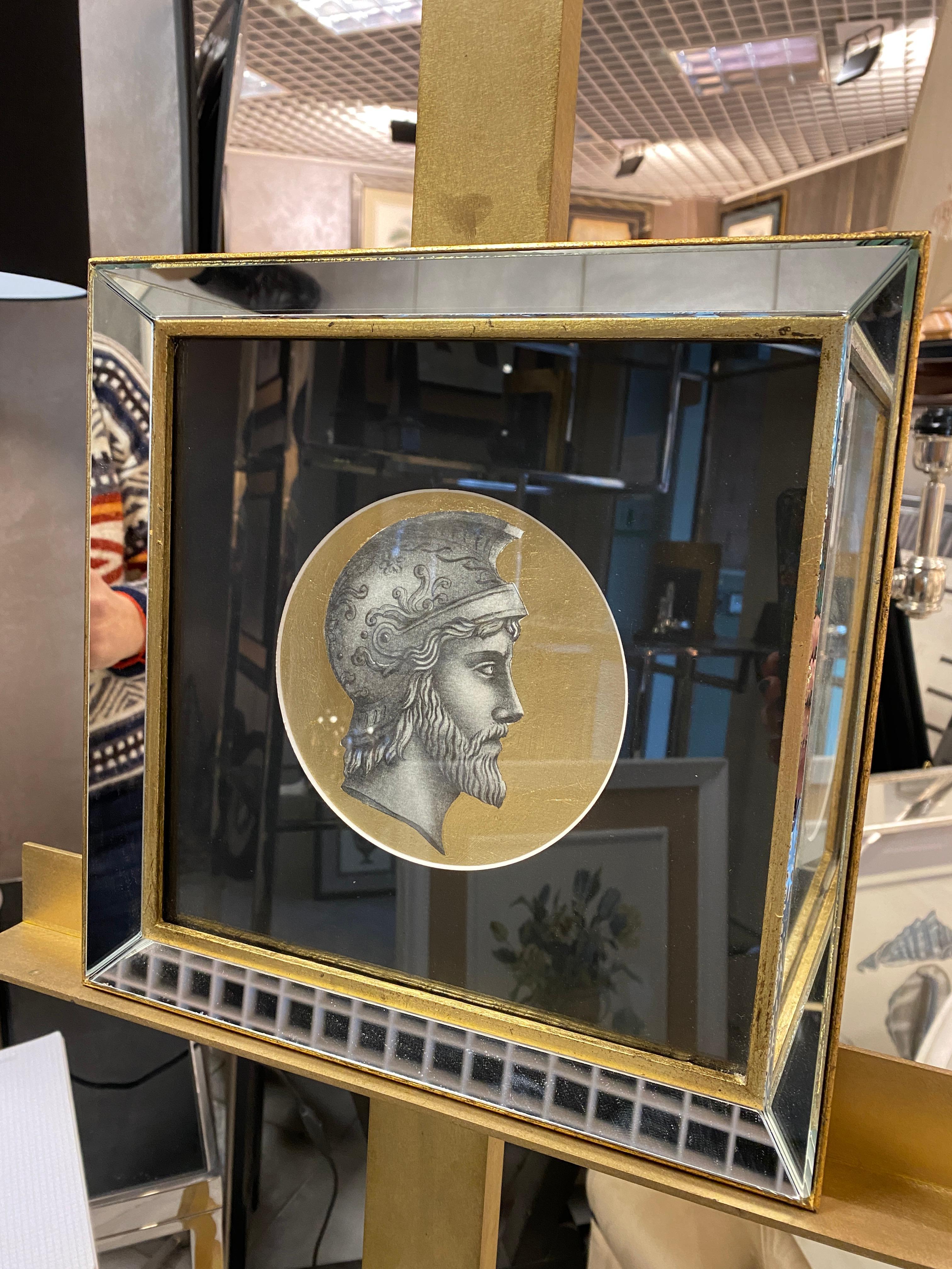 One of two etching printed ancient profile print with gold leaf background hand-gilded and enhanced with a square frame made of mirrors and gilded with gouache and burnished with a stone 
Each print is entirely printed in Italy by our