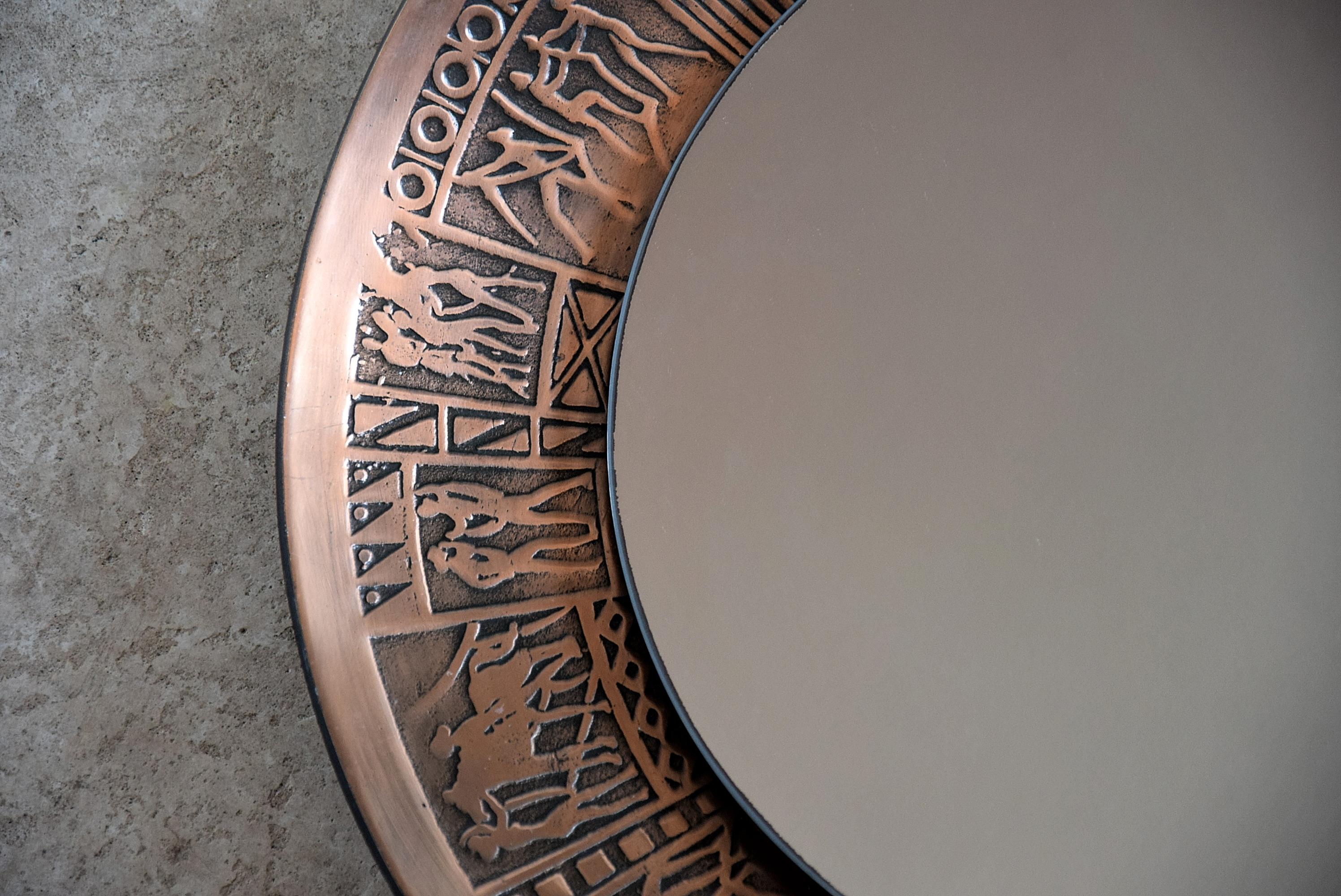 Stylish Mid-Century Modern Italian round copper wall mirror designed by MarCo Furgeri in the 1960s. This mirror used to hang in the City Hall of Bologna. It is stamped on the back with the Bologna City Hall stamp. This sophisticated and classy piece