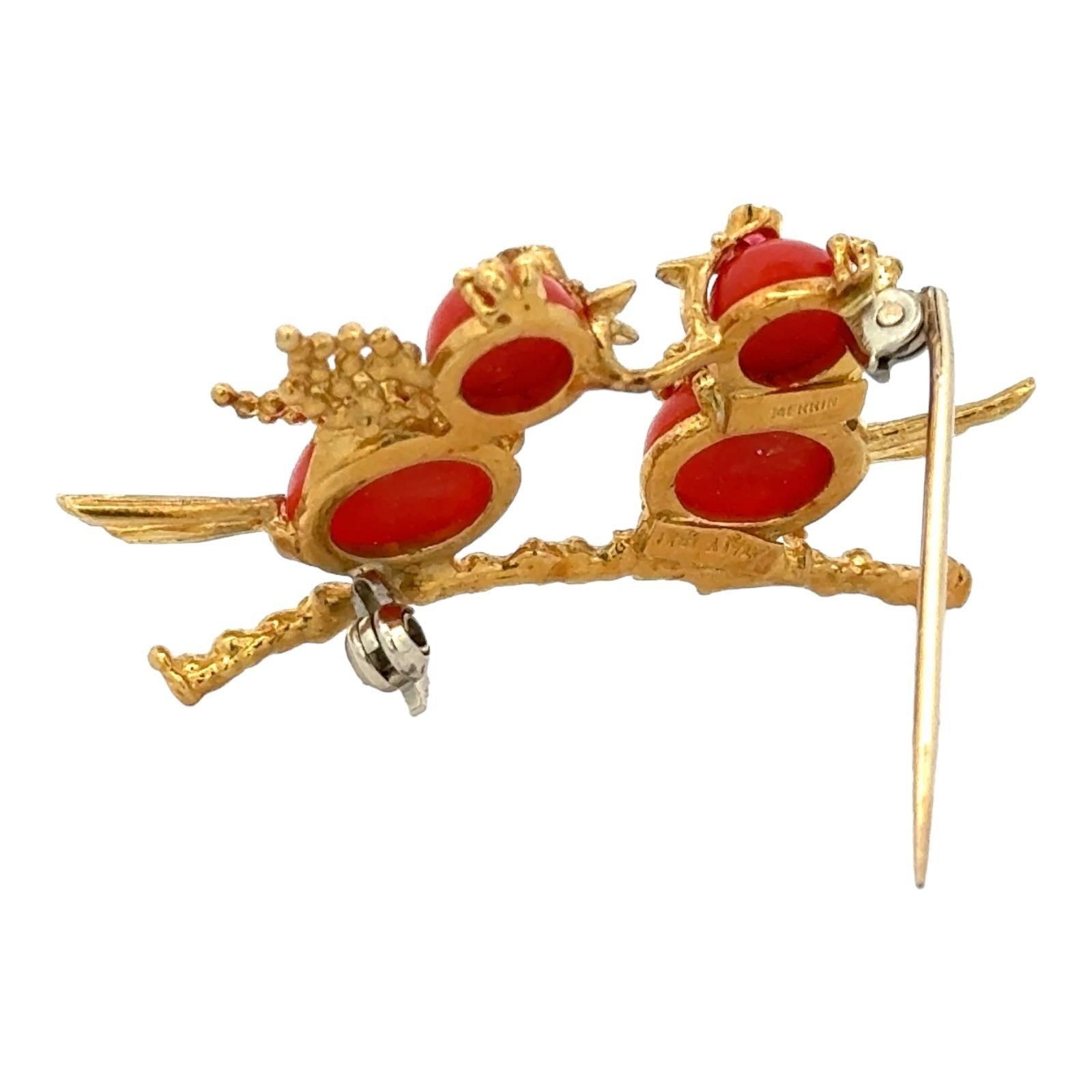 Adorable Italian coral lovebirds pin handcrafted in 18 karat yellow gold. The intricately designed birds feature cabochon coral gemstones and textured gold. The pin measures 1.00 x 1.75 inches. Stamped Italy 18Kt Merrin. Weight: 9.9 grams.