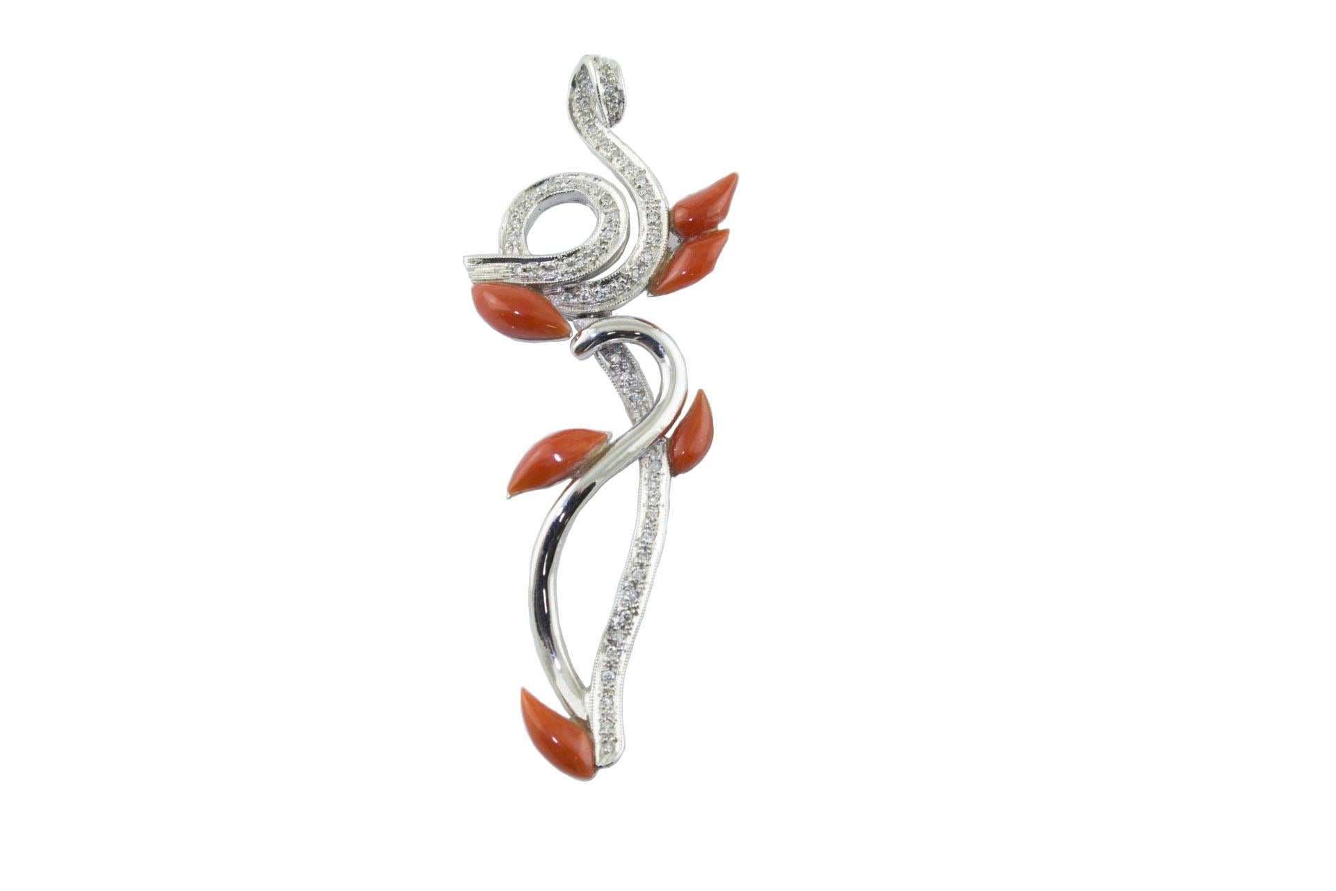 

Shiny pendant in 14Kt white gold. It represent a shape of intriguing silhouette embellished with diamonds and details in coral. The chain is not included.
diamonds(1.7Kt)
coral (0.55gr).
US Size
Width 0.78 inch
Length 2.36 inch
tot weight 7 gr
Rf.