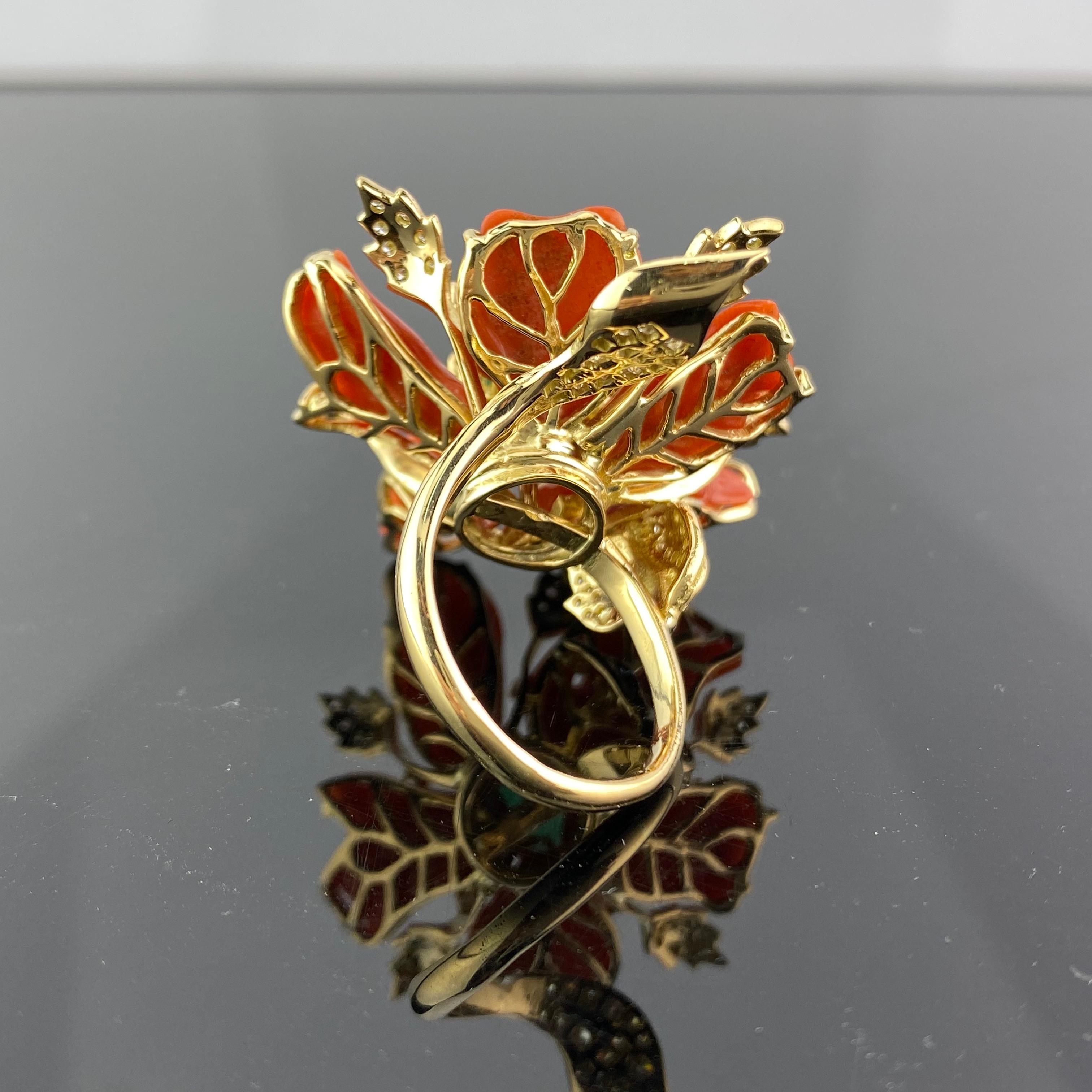 A beautiful, unique cocktail ring, made with natural Italian Coral adorned with White Diamonds and a centre cabochon Zambian Emerald. There is 15.35 carats of Coral, 0.84 carats of round white diamond, 1.30 carat of Emerald all set in 15.217 grams