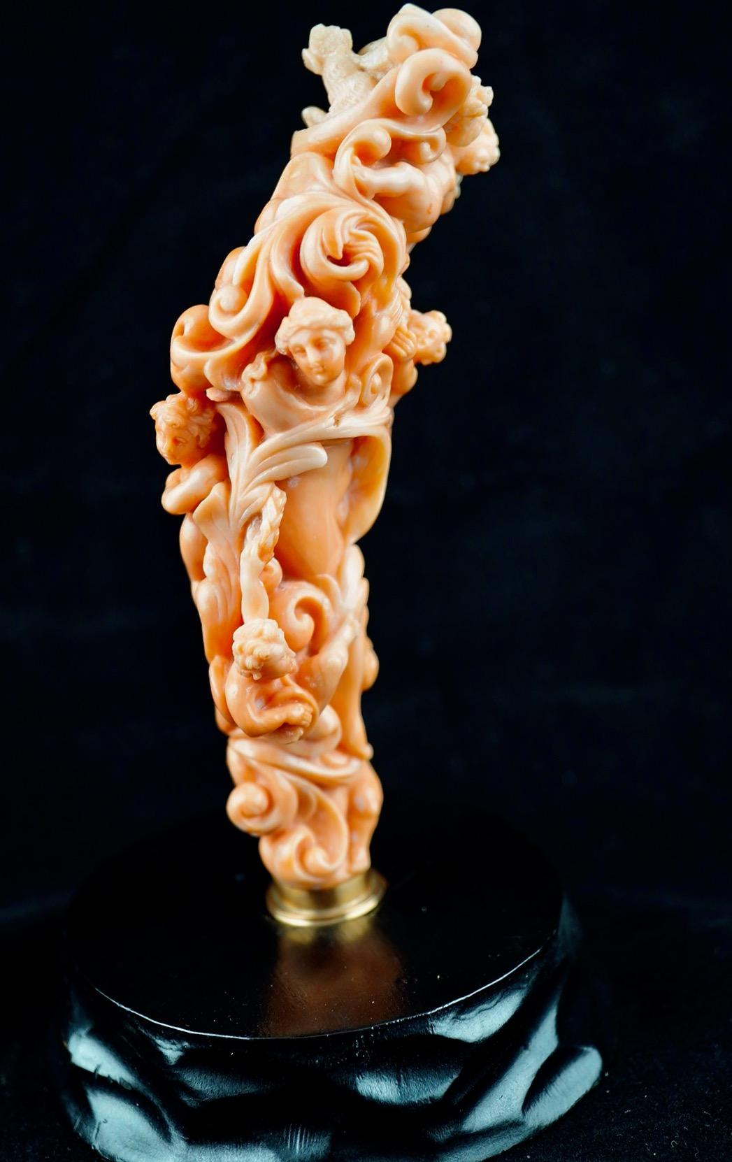 Italian carved coral parasol handle in Baroque style. The handle dates to early 19th century. Most likely made in Torre del Greco near Naples. Fine figural goddess surrounded by angels. The handle is 4 3/4