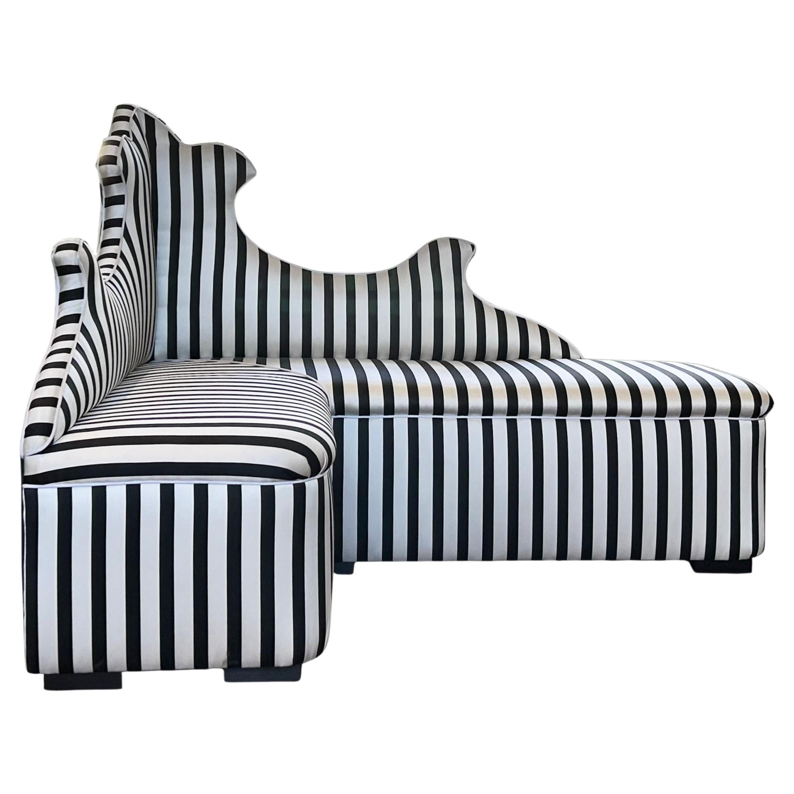 Corner sofa attributed to Gio Ponti, upholstered in a  black and white silk fabric by Christian Lacroix