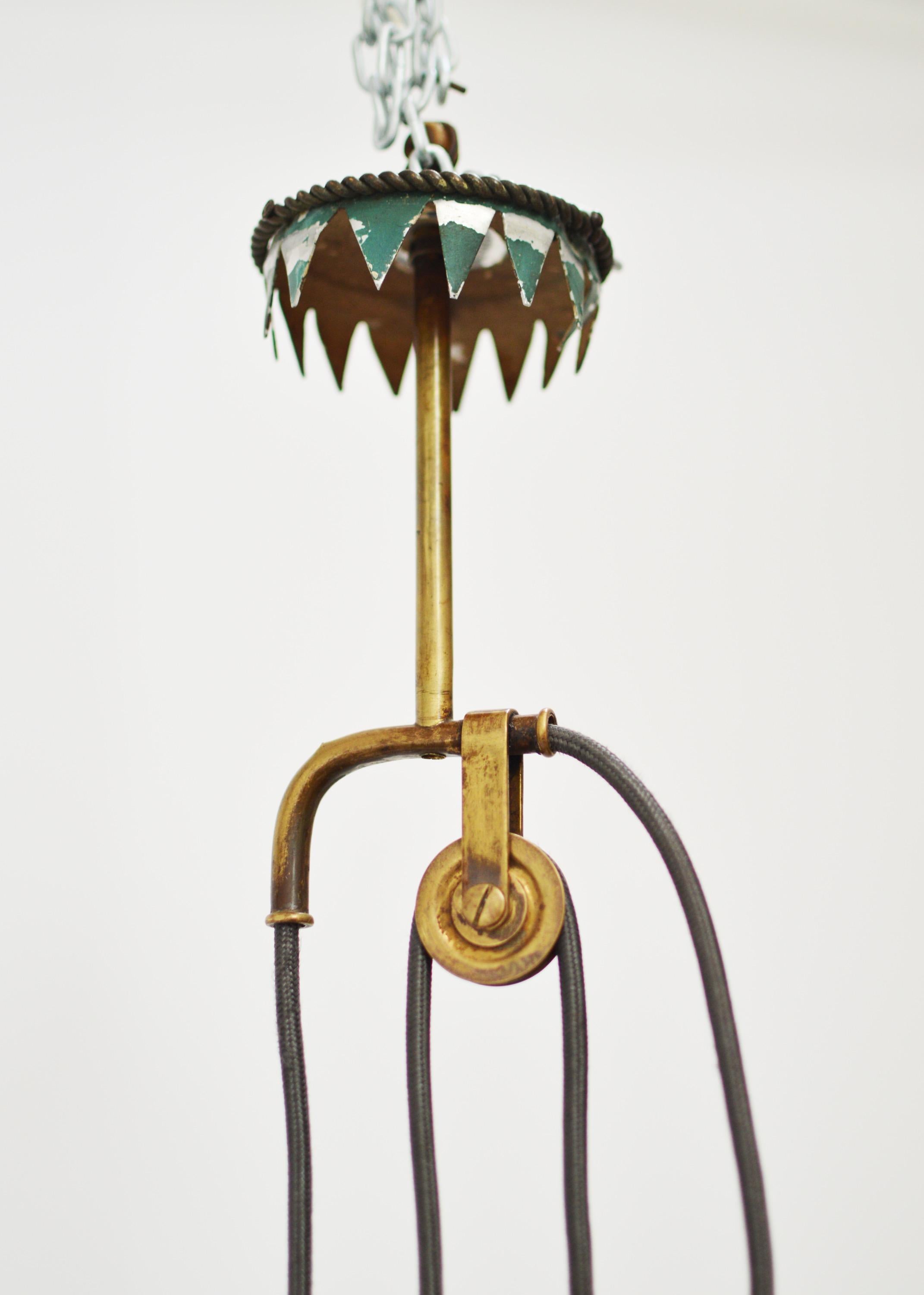 Adjustable height Italian counter balance light with mint green, painted aluminium shade and brass fittings. Diameter 50 cm. Drop of light can be adjusted as desired with rise and fall of weight. Minimum extension 110 cm. Maximum extension 150