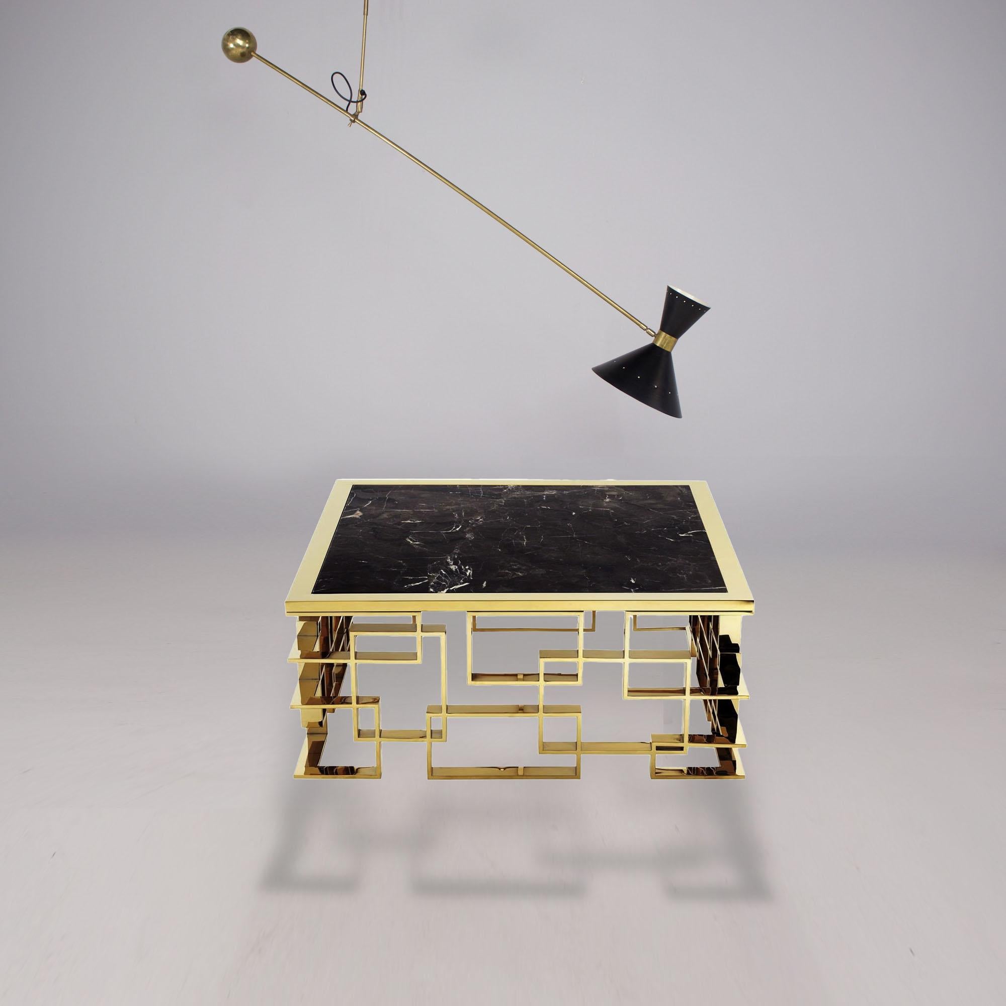 Ceiling Light in the Stilnovo or Guariche style.
Brass rod ending in a spherical weight. Double diabolo reflectors made of lacquered metal.
Adjustable tilt.

Vertical rod: 90 cm
Adjustable rod: 200 cm
Diabolo: D28 x H30