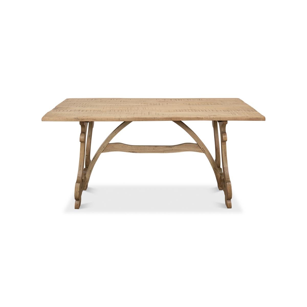 Dining Table in an unusual light drift walnut finish, with plank board top above a trestle end base with a stretcher.

Dimensions: 63