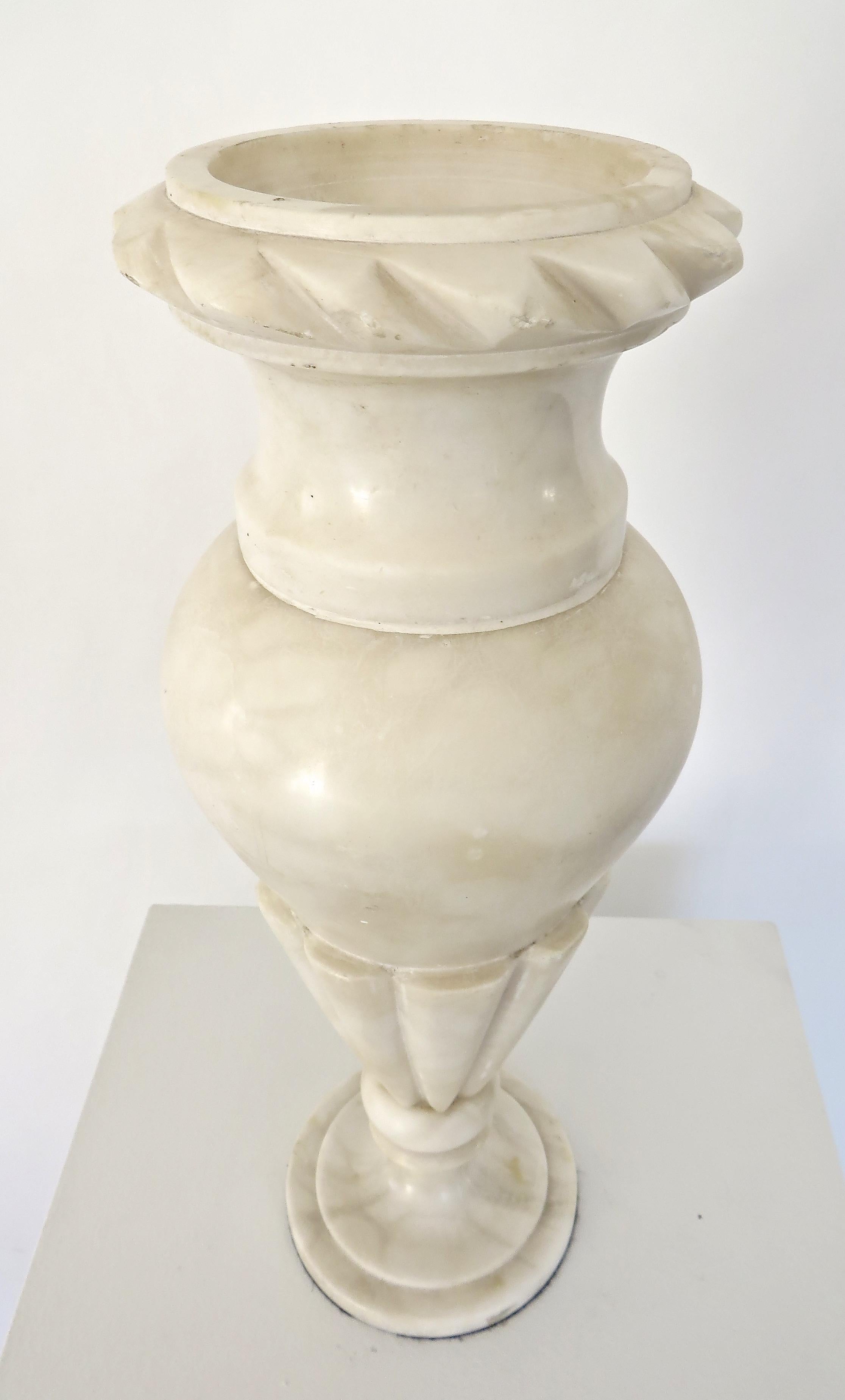 Italian cream carved alabaster vase in the neoclassical style. 
For decorative use as it was formerly a lamp, 
circa 1920-1930.