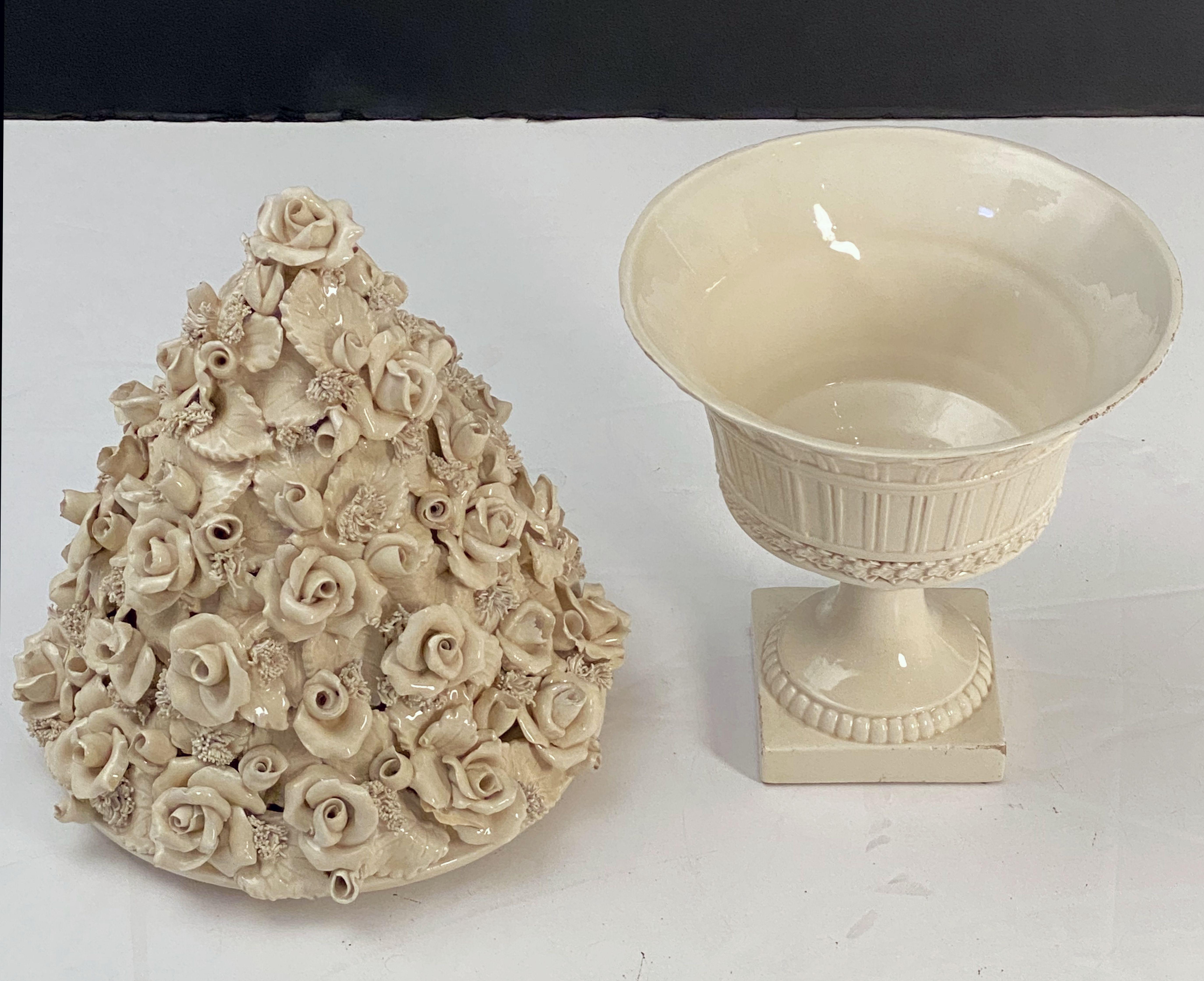 A fine large Italian cream-ware or white glazed ceramic pedestal bowl with rose topiary top, featuring a fitted lid with a relief of roses (or rosettes) and bocage around the circumference, over a lower body with bowl and pedestal support on a