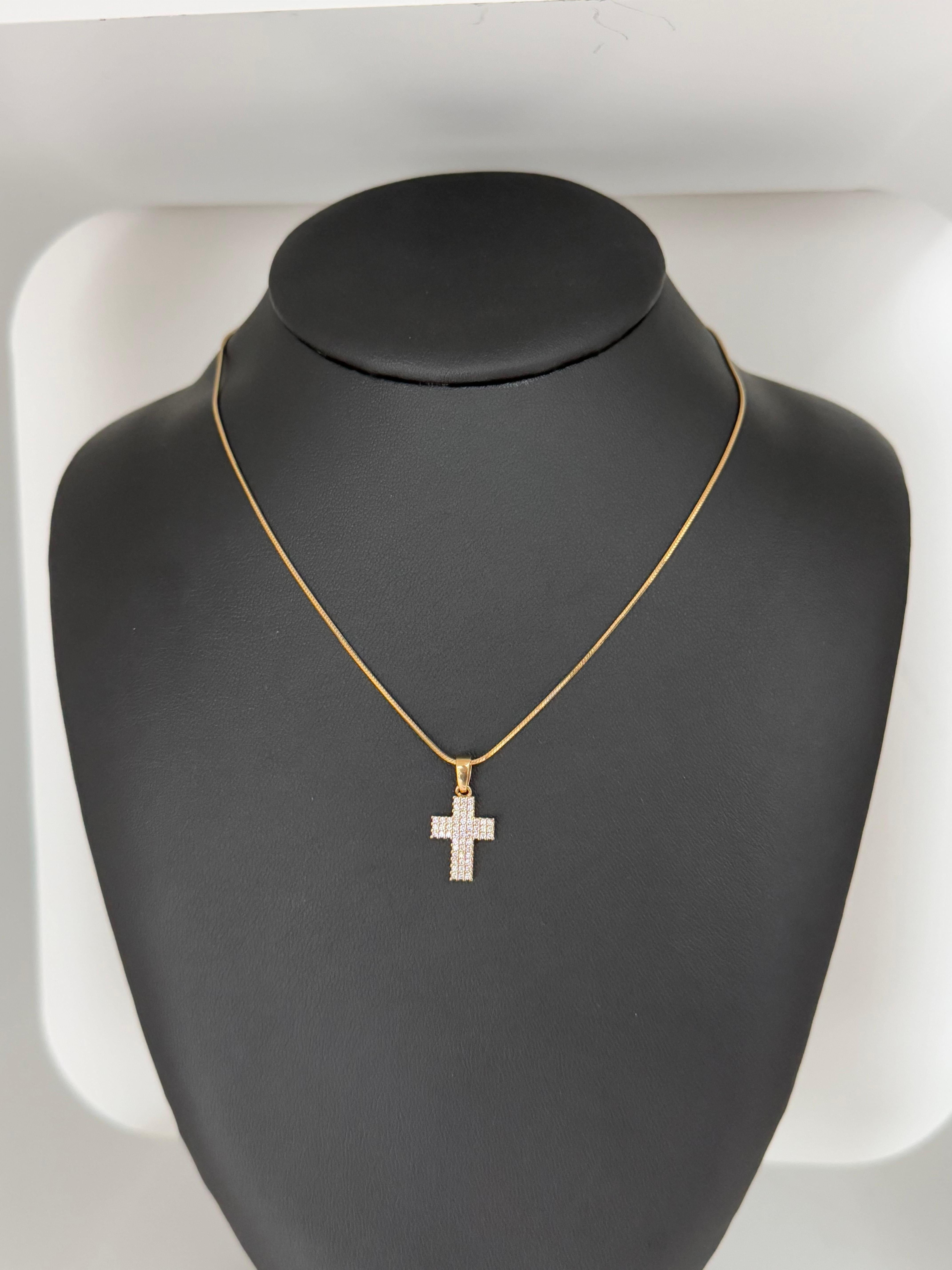 This elegant Italian Cross Pendant is crafted in luxurious 18 karat yellow gold and adorned with brilliant-cut natural diamonds totaling approximately 0.50 carats. The diamonds are prong-set, allowing maximum light to enhance their brilliance and