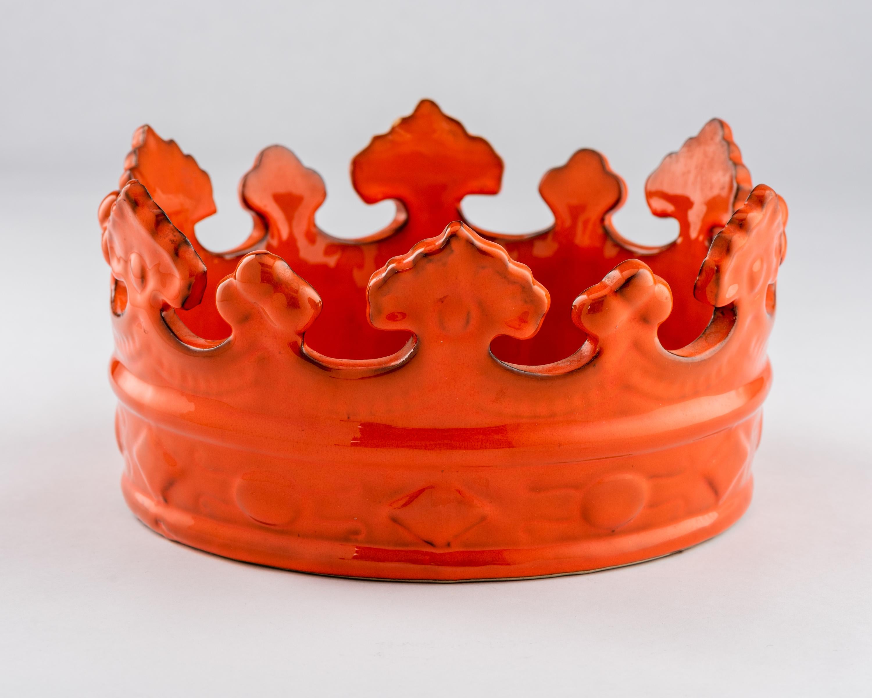 Italian crown, bowl, ceramic, orange, signed. Medium scale fun crown bowl glazed in orange and decorated with raised jewel motifs around the band. Signed on the underside: 