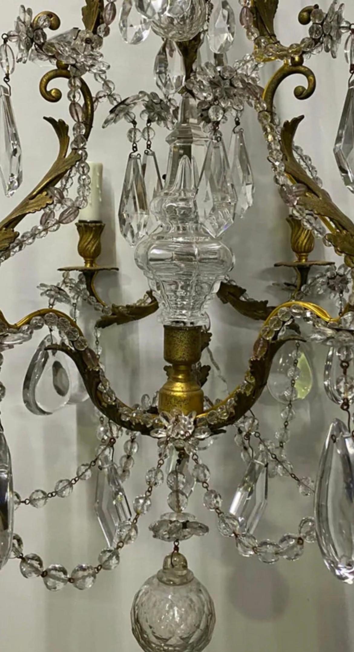 A stunning 6 arm Italian Crystal solid brass chandelier that is wired, cleaned and ready to go for it's new home. This piece exudes luxury and refinement. We feel that this a complete staple piece and is beautiful for any space whether it be a