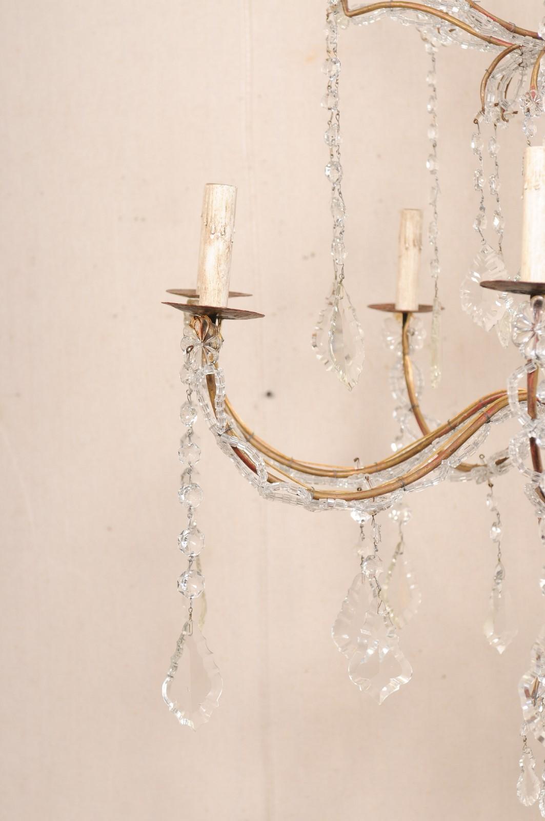 Lampadario italiano a 8 luci in cristallo con colonna centrale in legno intagliato, metà del XX secolo. In condizioni buone in vendita a Atlanta, GA