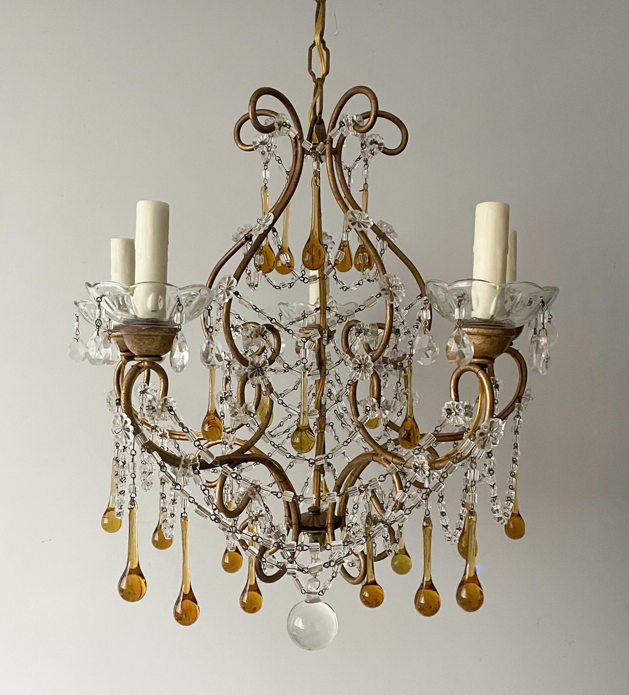 Gorgeous, vintage Italian gilt-iron and crystal beaded chandelier with Murano glass drops. 

The chandelier consists of a curvaceous gilded iron frame decorated crystal bead swags and Murano glass drops in a honey amber color. 

The chandelier is
