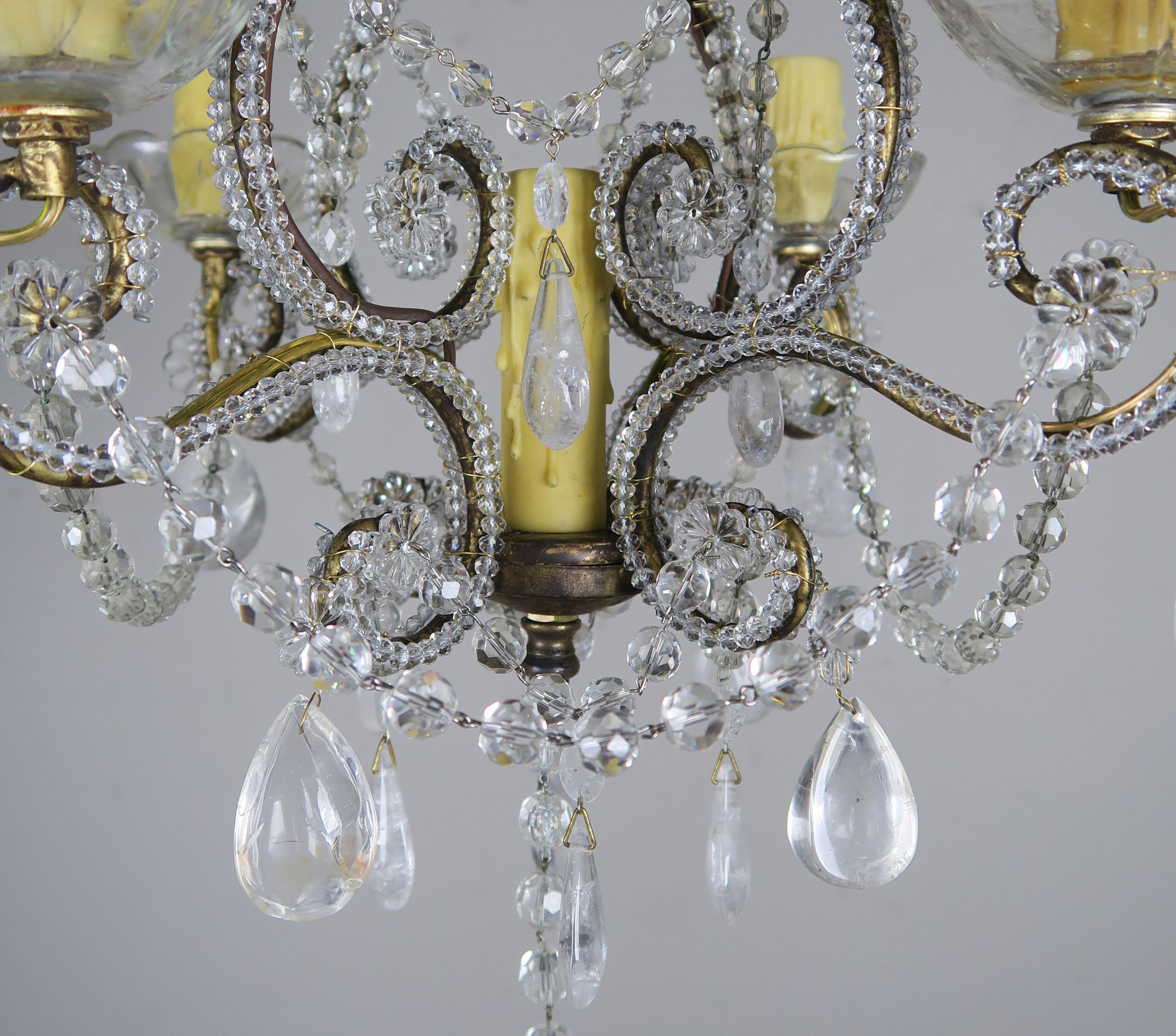 4-light Italian crystal beaded chandelier adorned with almond rock crystals throughout. The fixture is newly rewired with tallow colored drip wax candle covers. Includes chain and canopy.